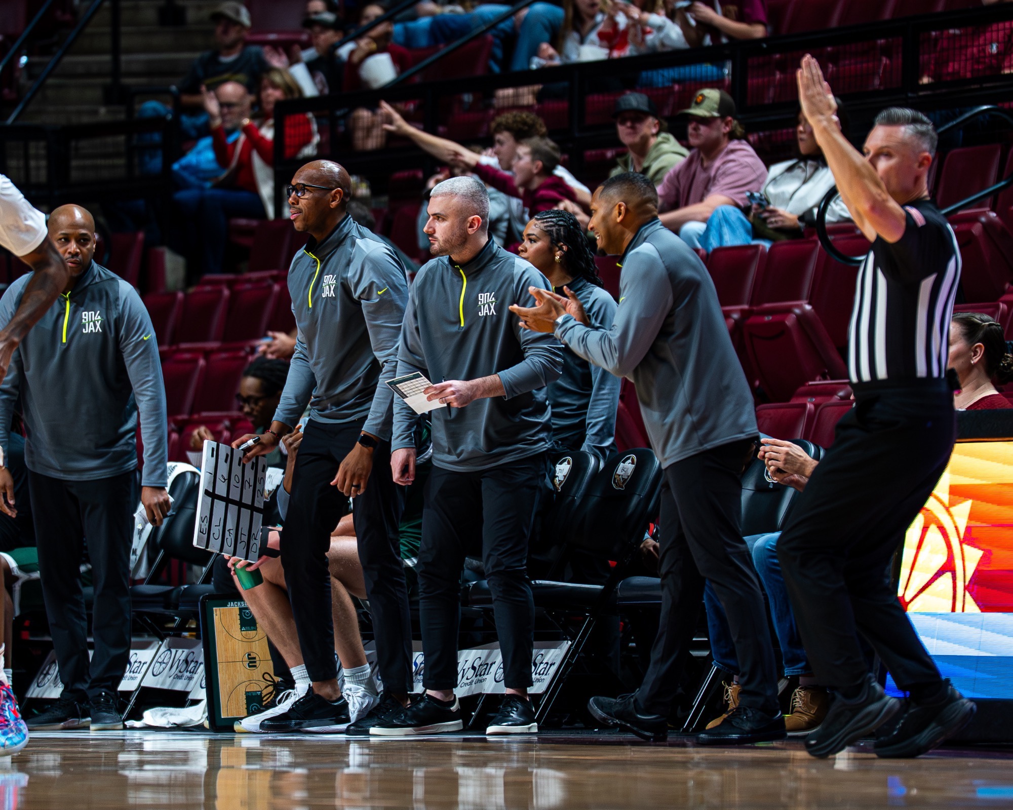 JU basketball coaches celebrate against FSU 12/22/25