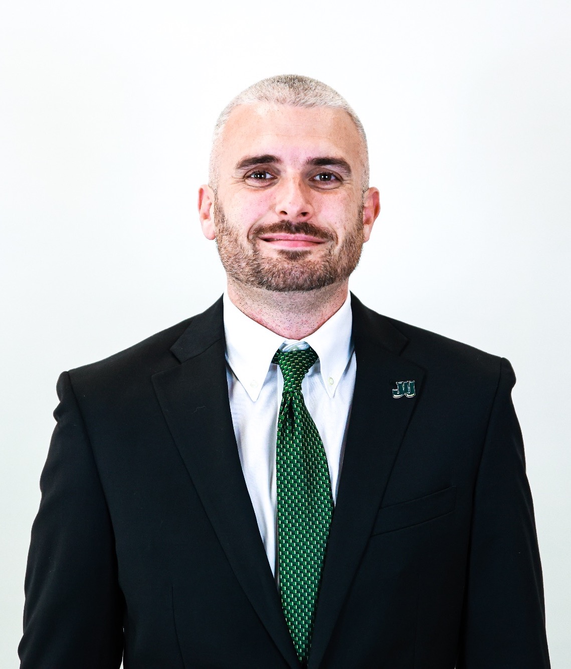Brett Comer updated headshot summer 2025