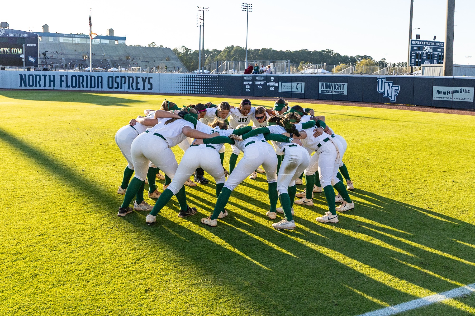 Jacksonville softball team huddle v. UNF 03/20/26
