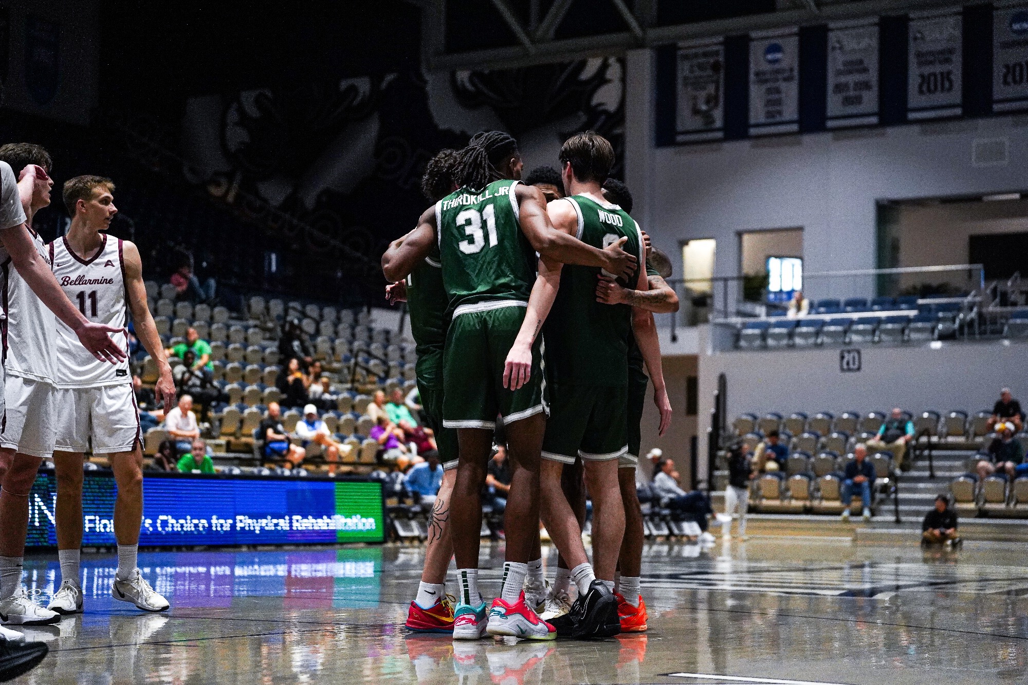 JU MBB team huddle after Bellarmine ASUN Tournament game 03/04/26