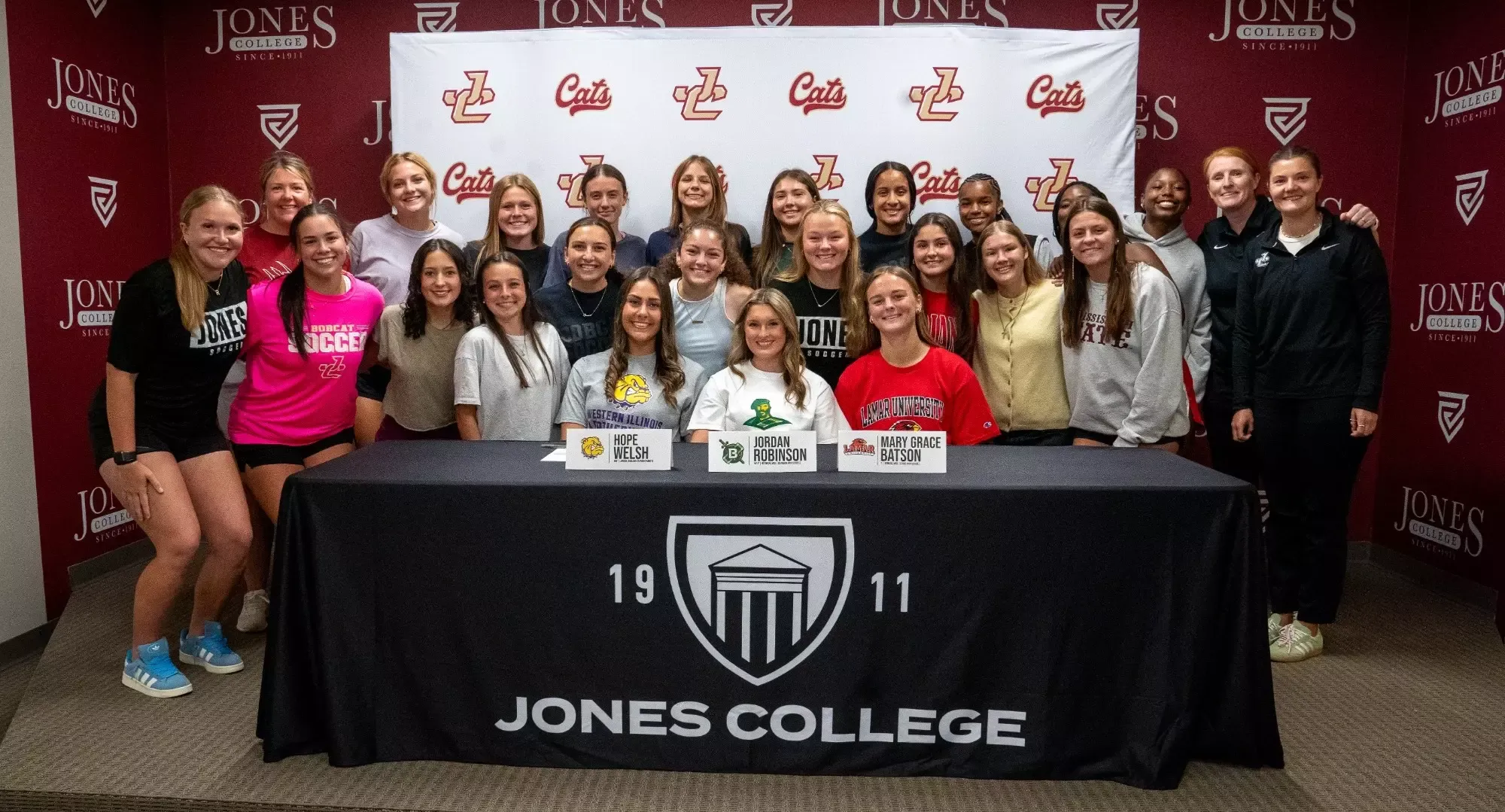2026 women's soccer signees pose for a picture
