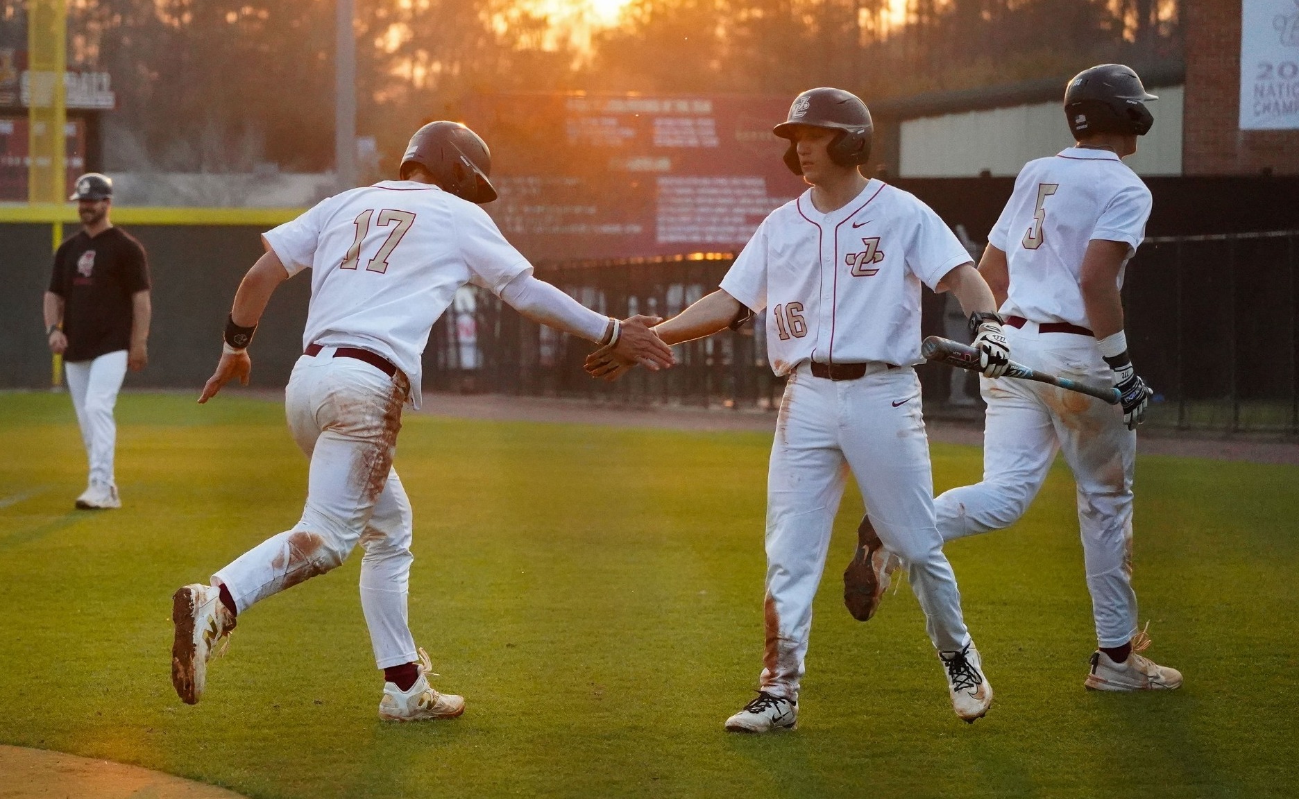 warren hutchinson greets Brayden Quick after scoring a run