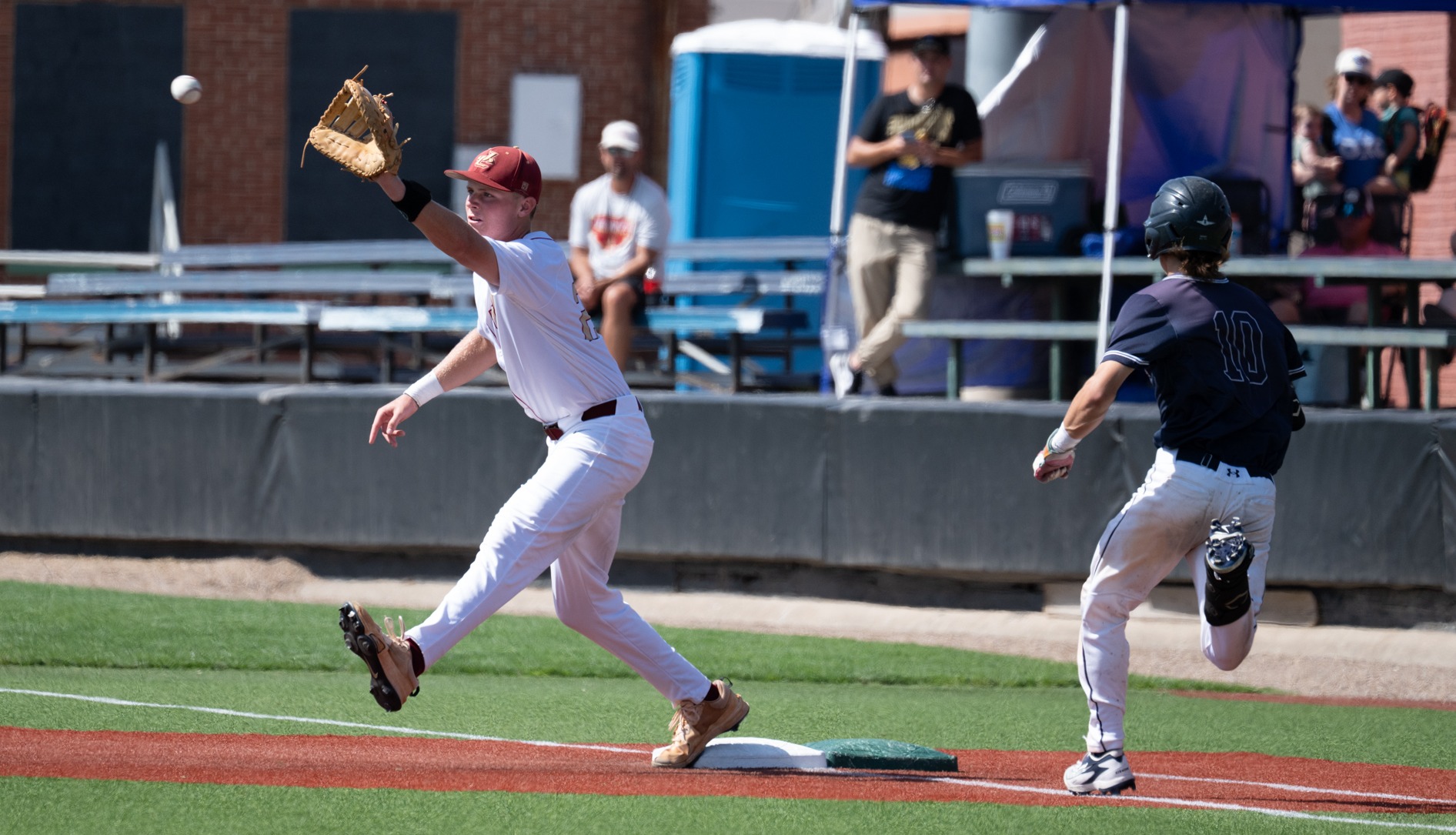 sanders ainsworth stretches to make a play at first base