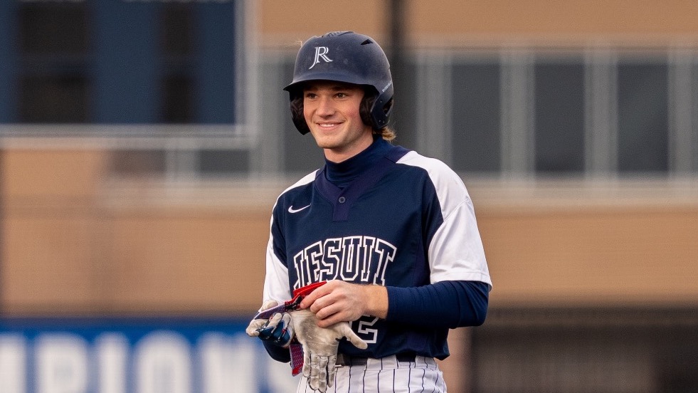 Taylor Haddock smiling for his senior poster
