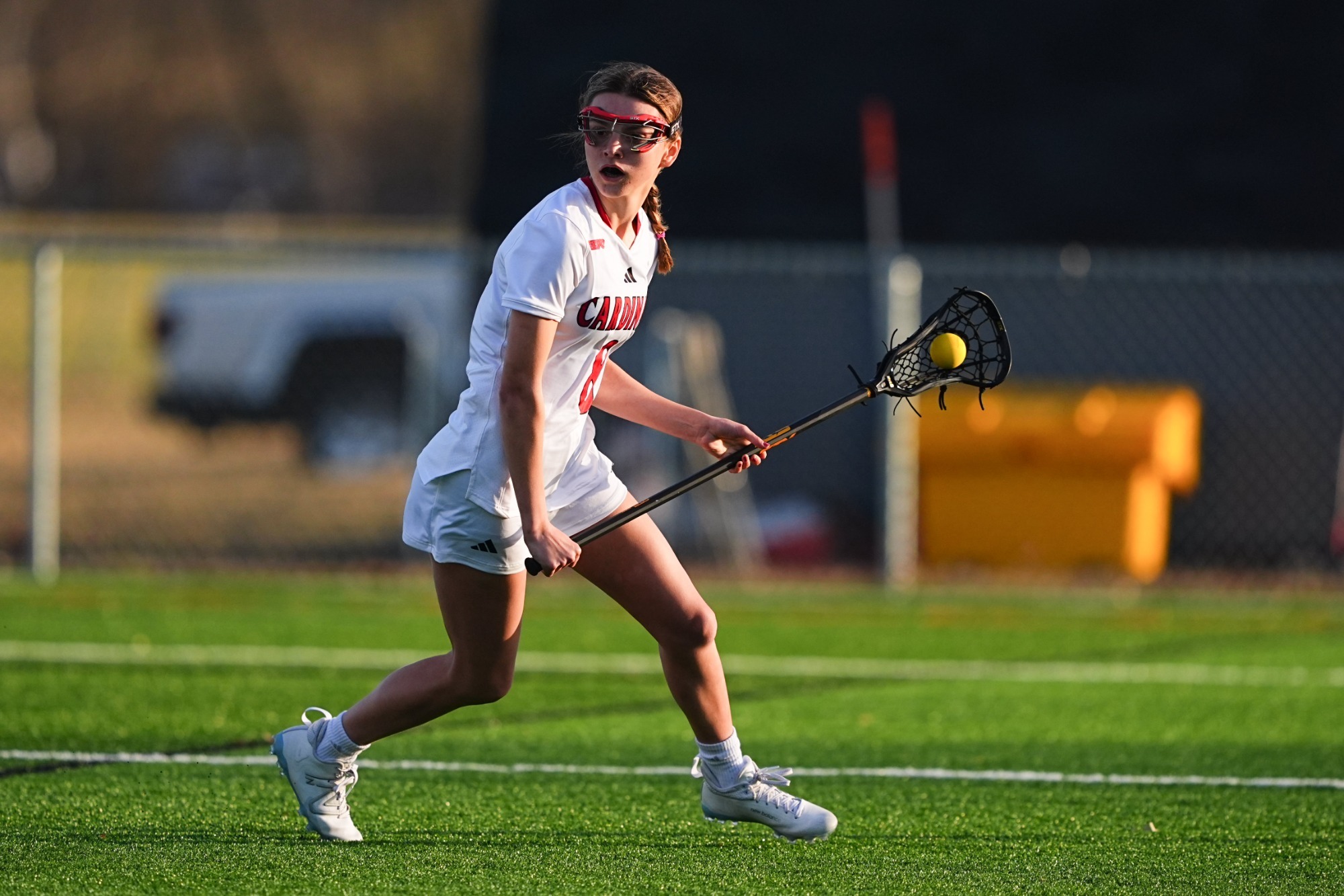 Olivia Fornelli holding ball in lacrosse stick