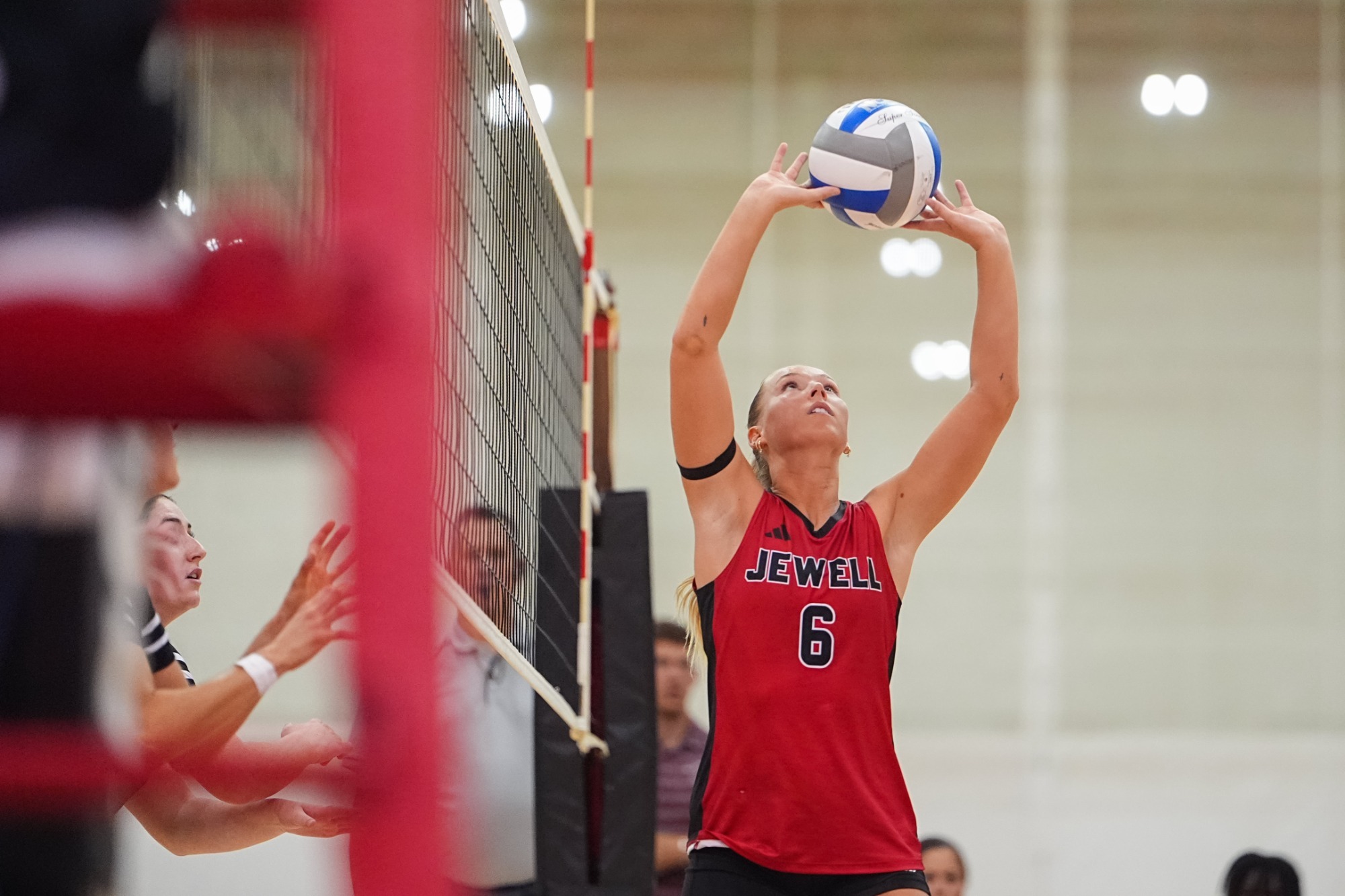 Reaghan Bible setting a volleyball