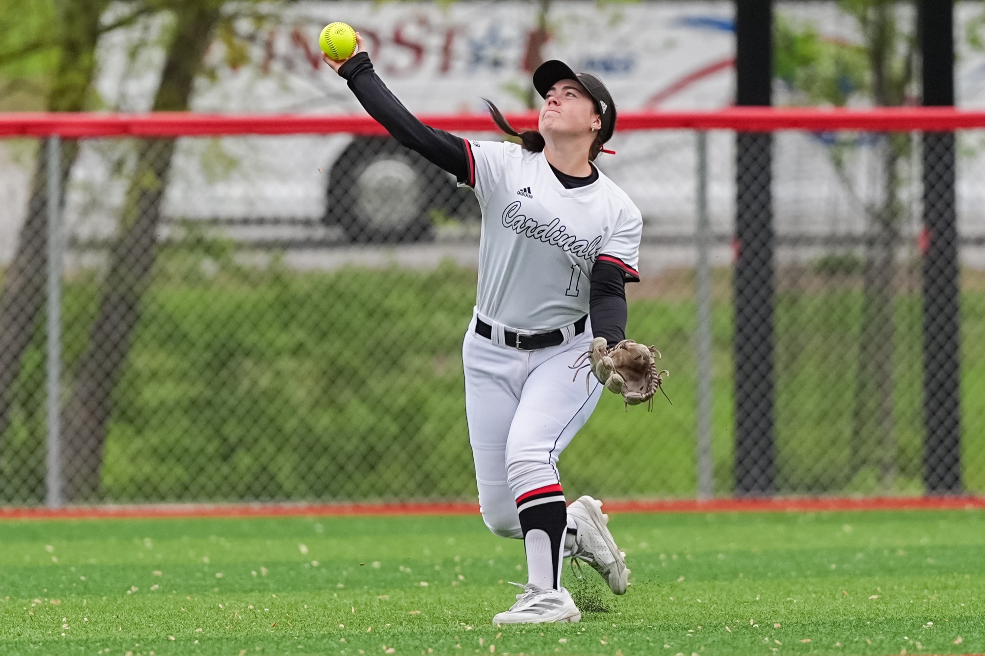 Avery Webster throwing a softball