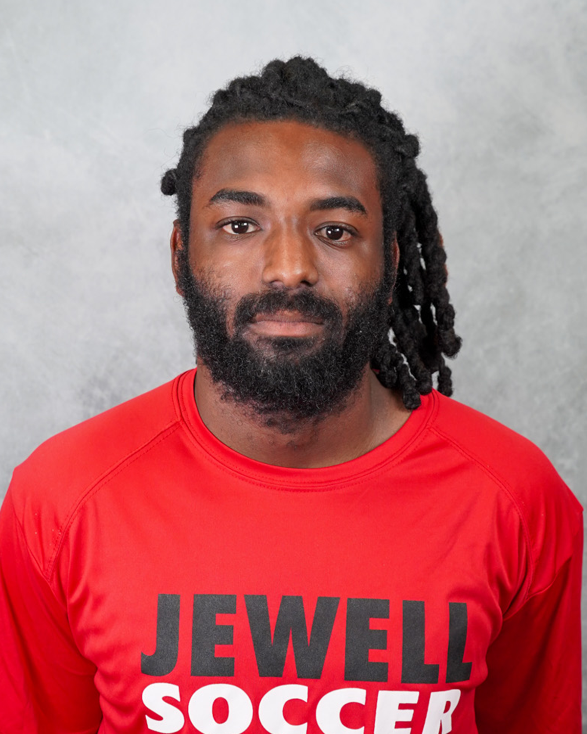 Naguib Nassir headshot wearing a red Jewell soccer tshirt