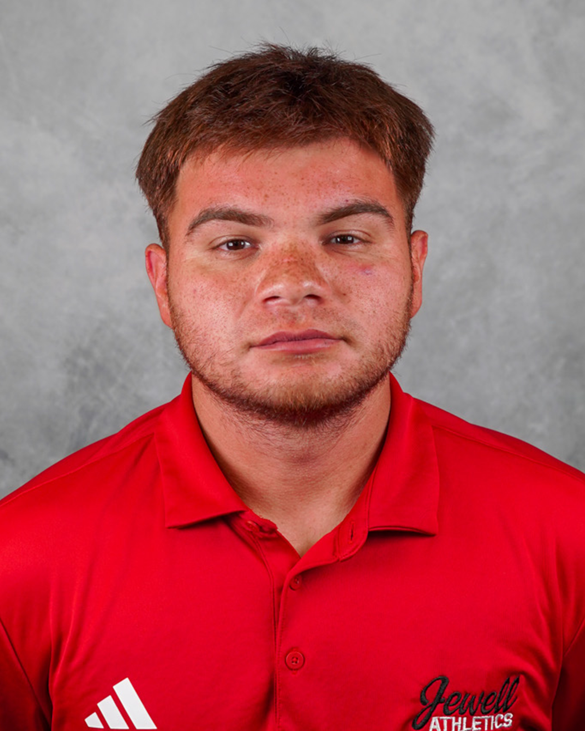 Jose Zertuche, assistant coach in a red Jewell polo shirt
