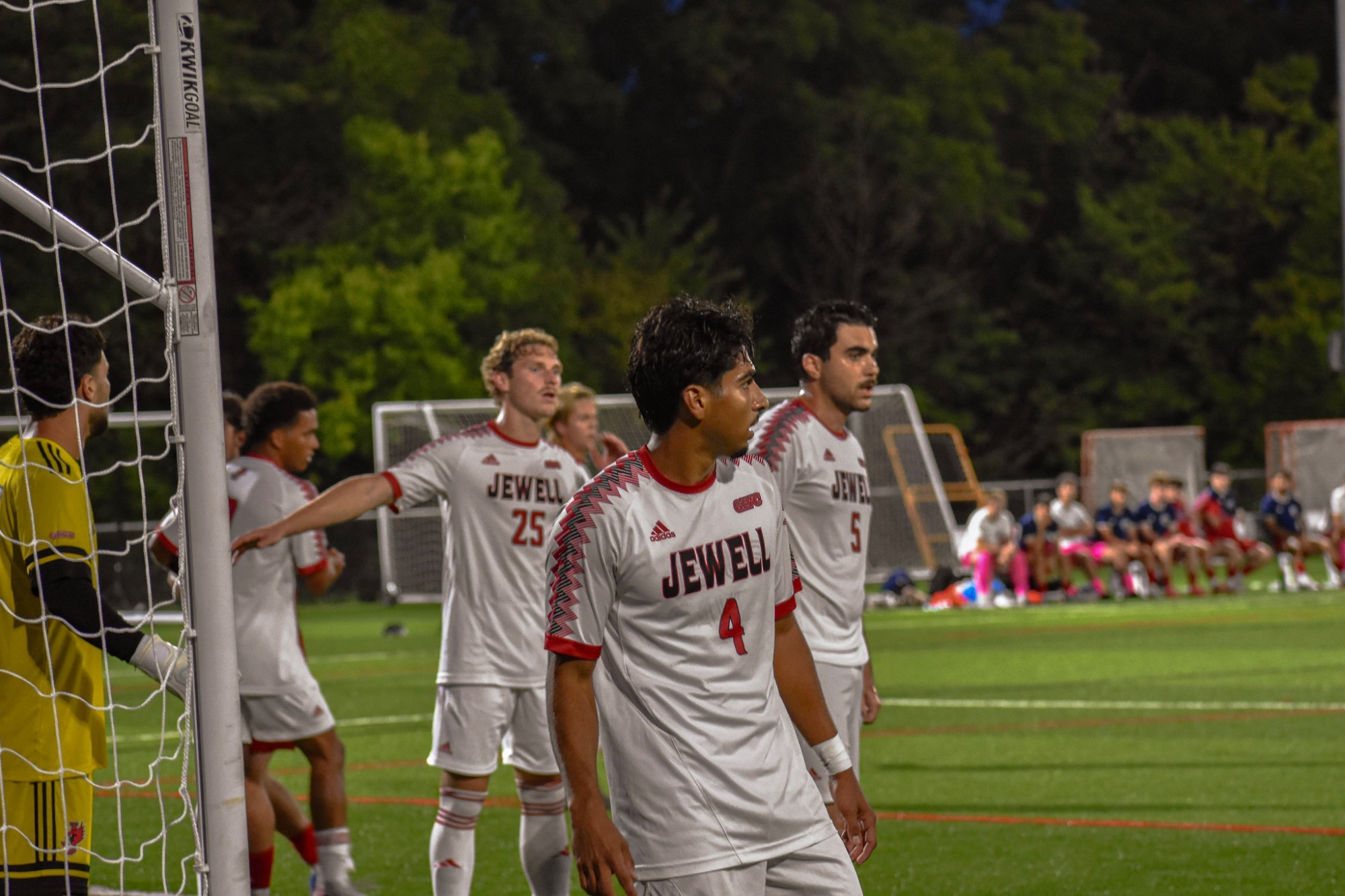Nico Rivera stands near the goal in a white jersey