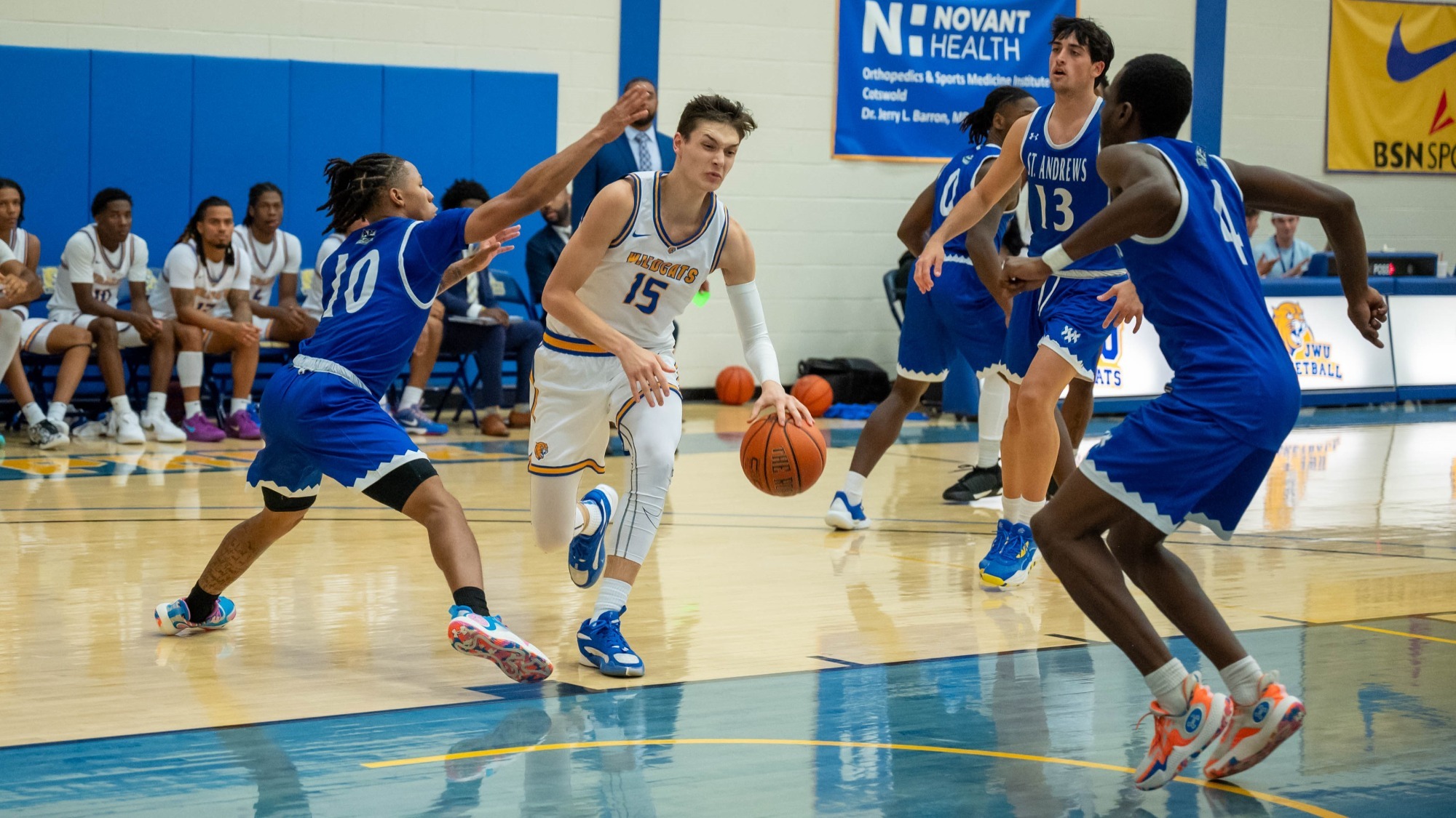 man dribbling a basketball