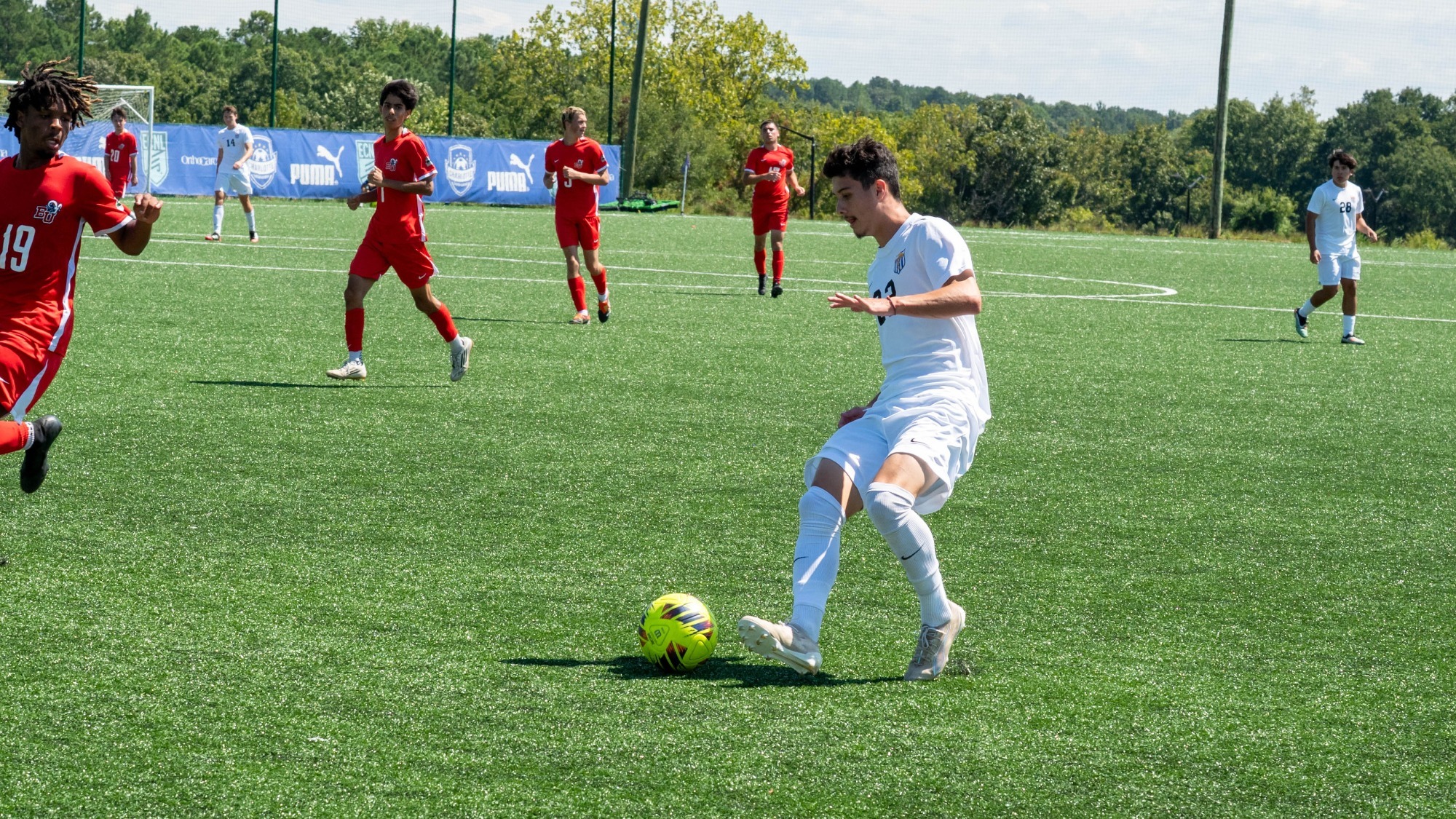 man dribbling a soccer ball