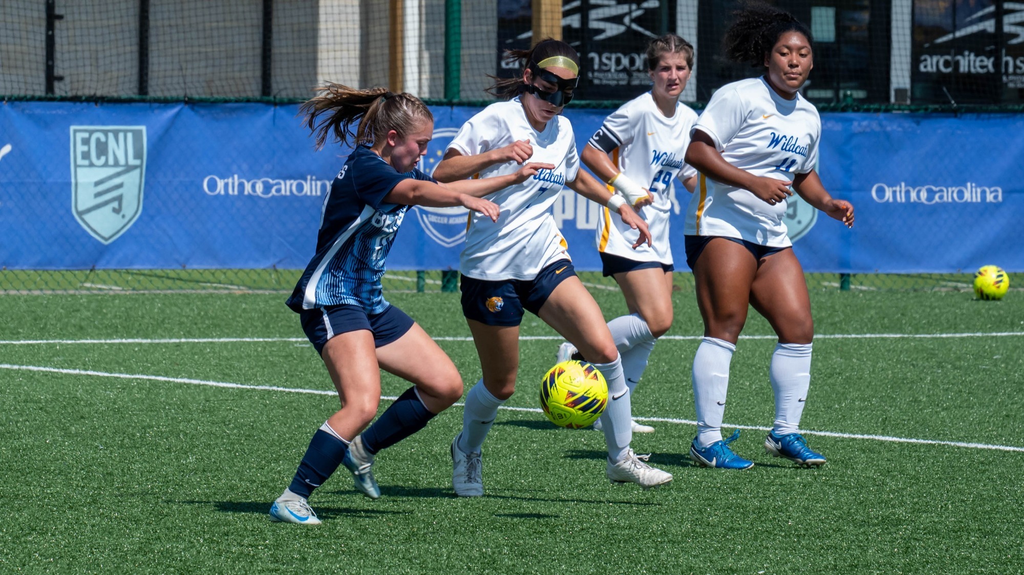 women battling for a soccer ball