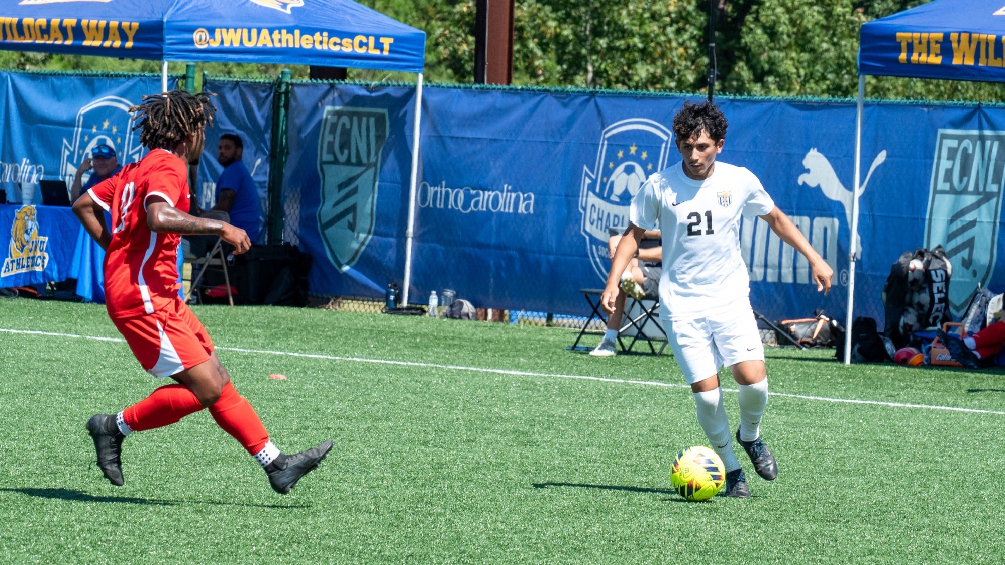 man dribbling a soccer ball