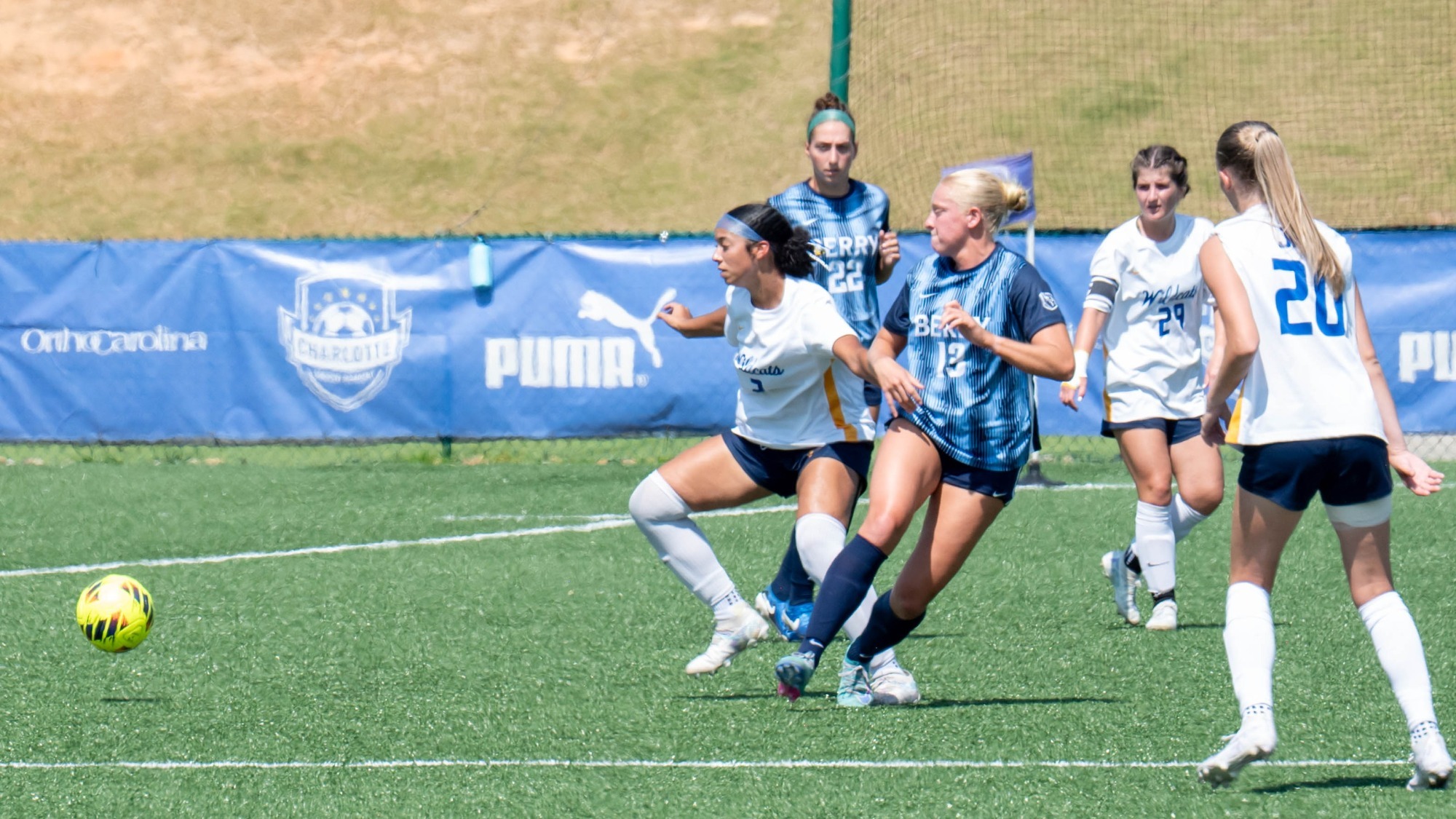 women battling for a soccer ball