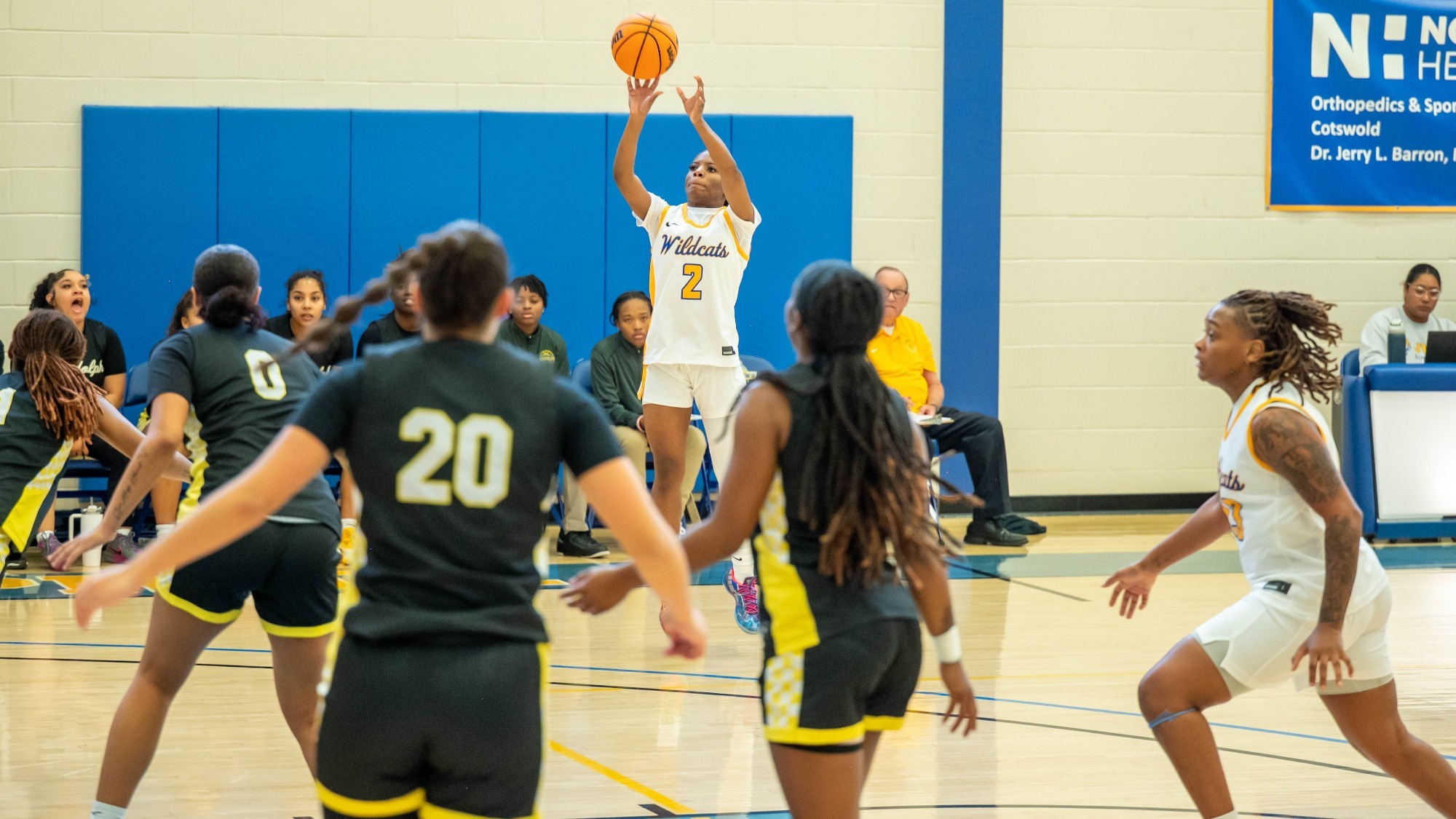 woman shooting a basketball