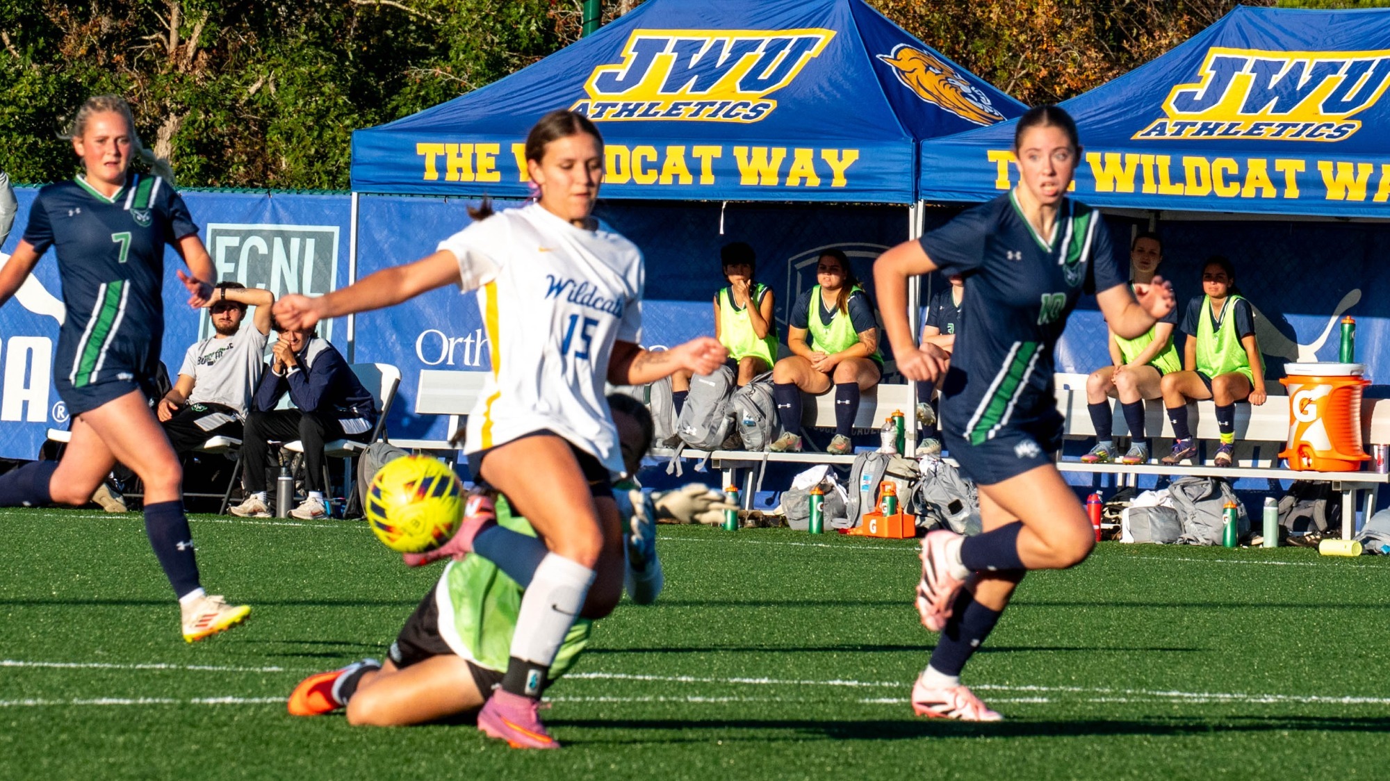 woman kicking a soccer ball