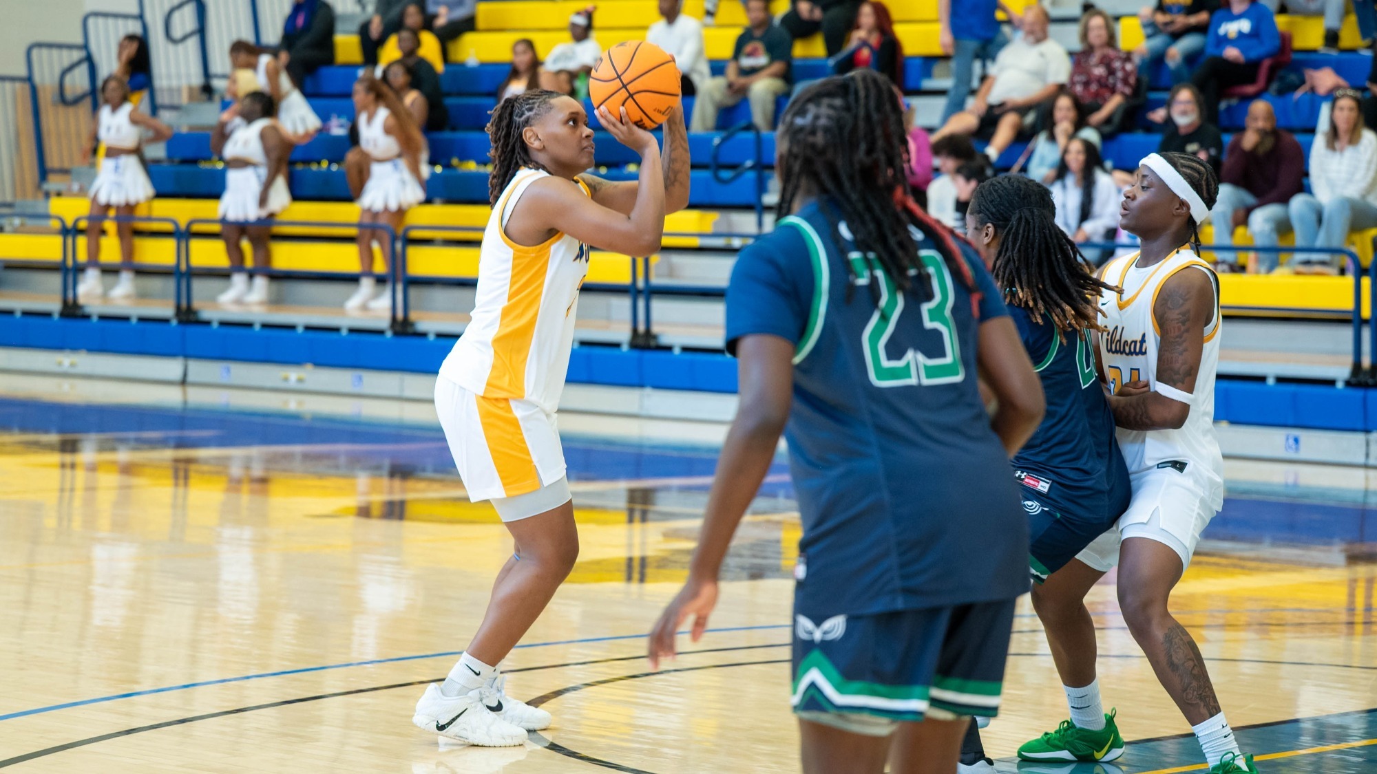 woman shooting a basketball