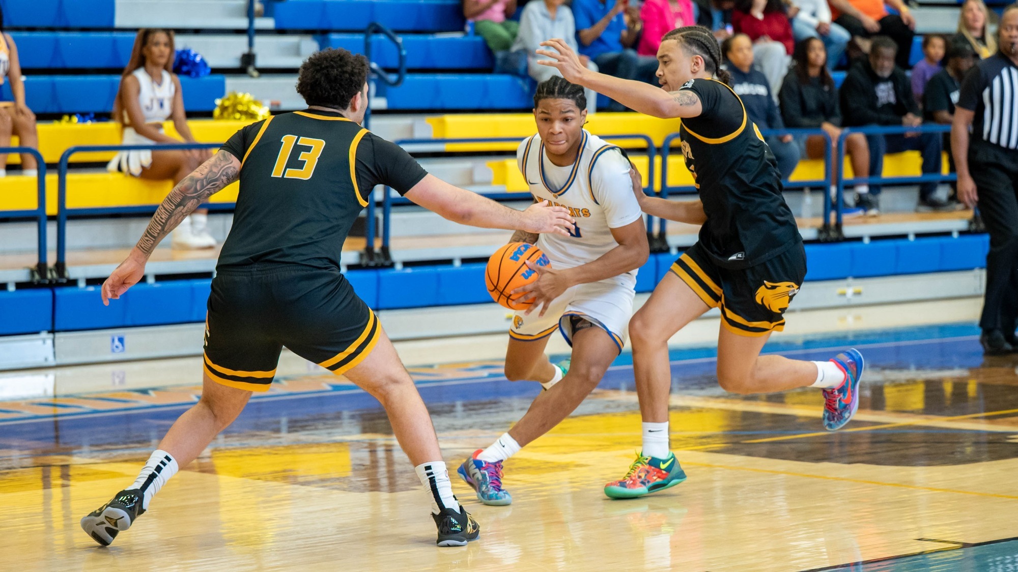 man dribbling a basketball