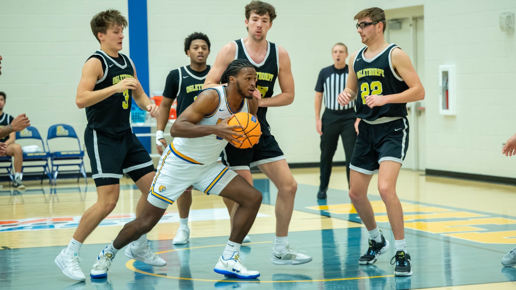 man shooting a basketball