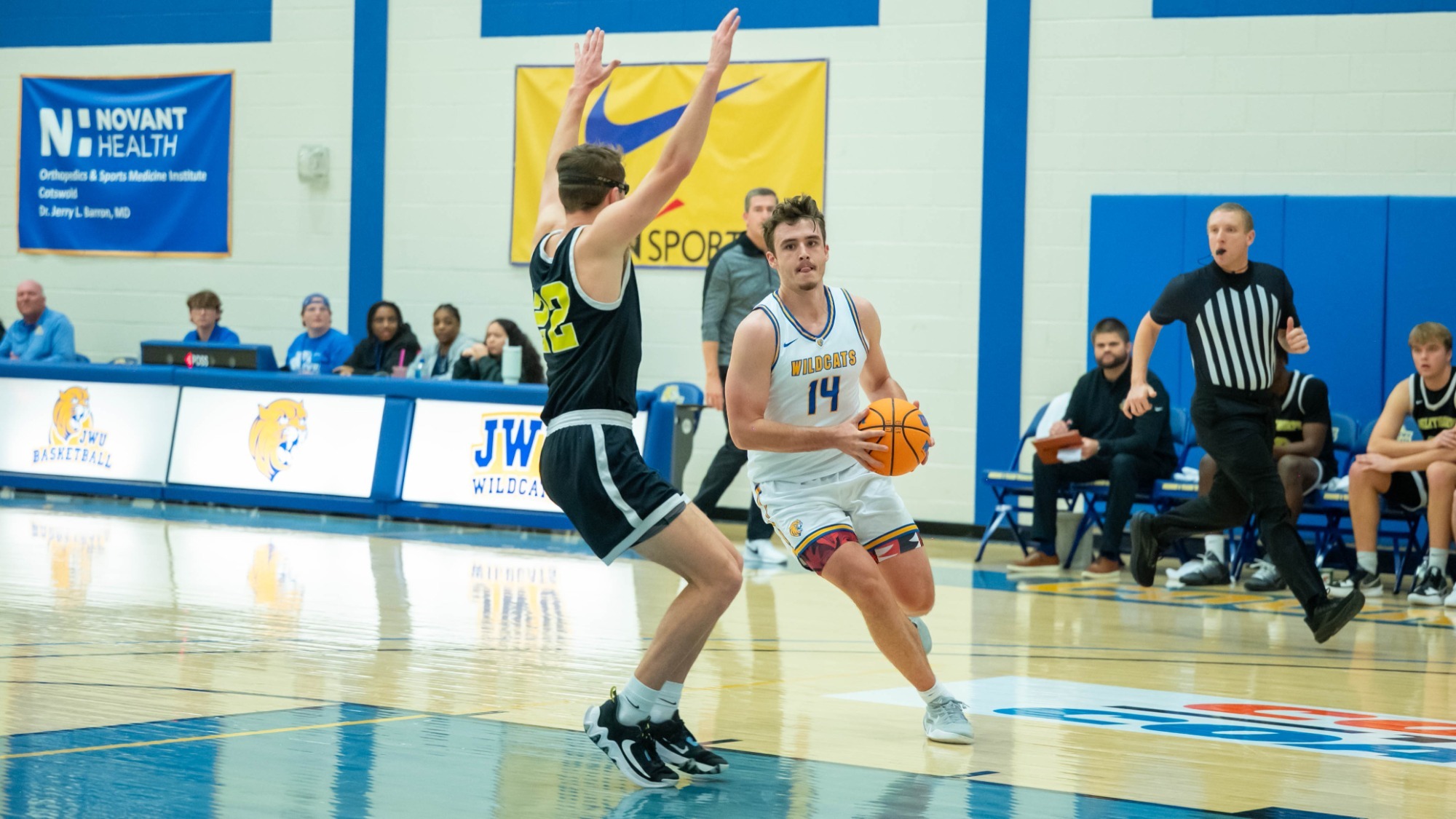 man shooting a basketball