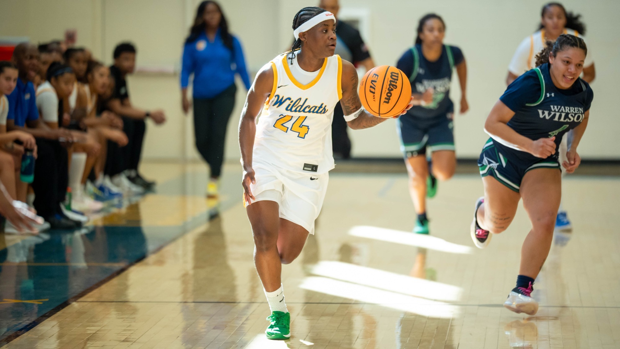 woman dribbling a basketball