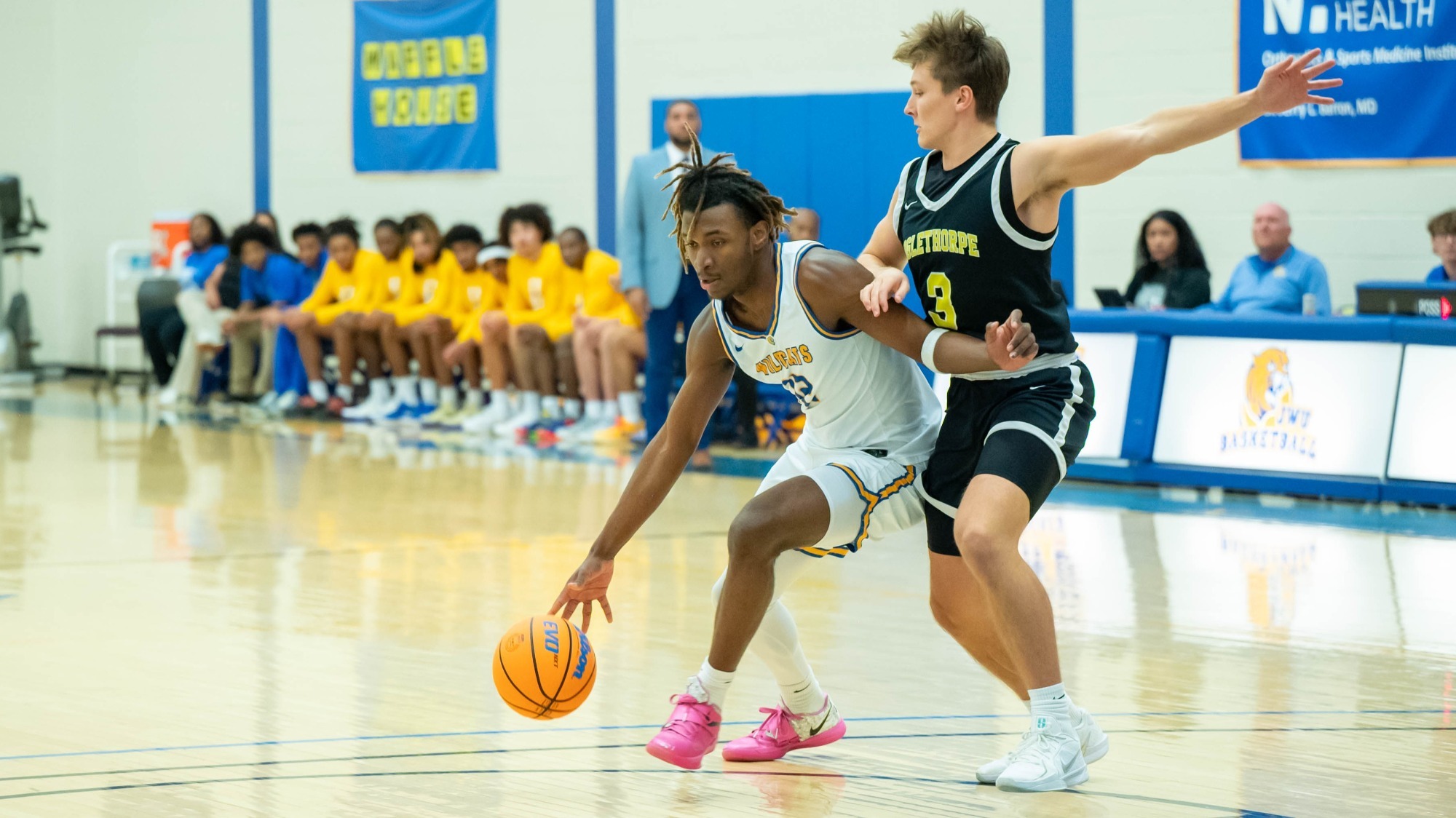 man dribbling a basketball