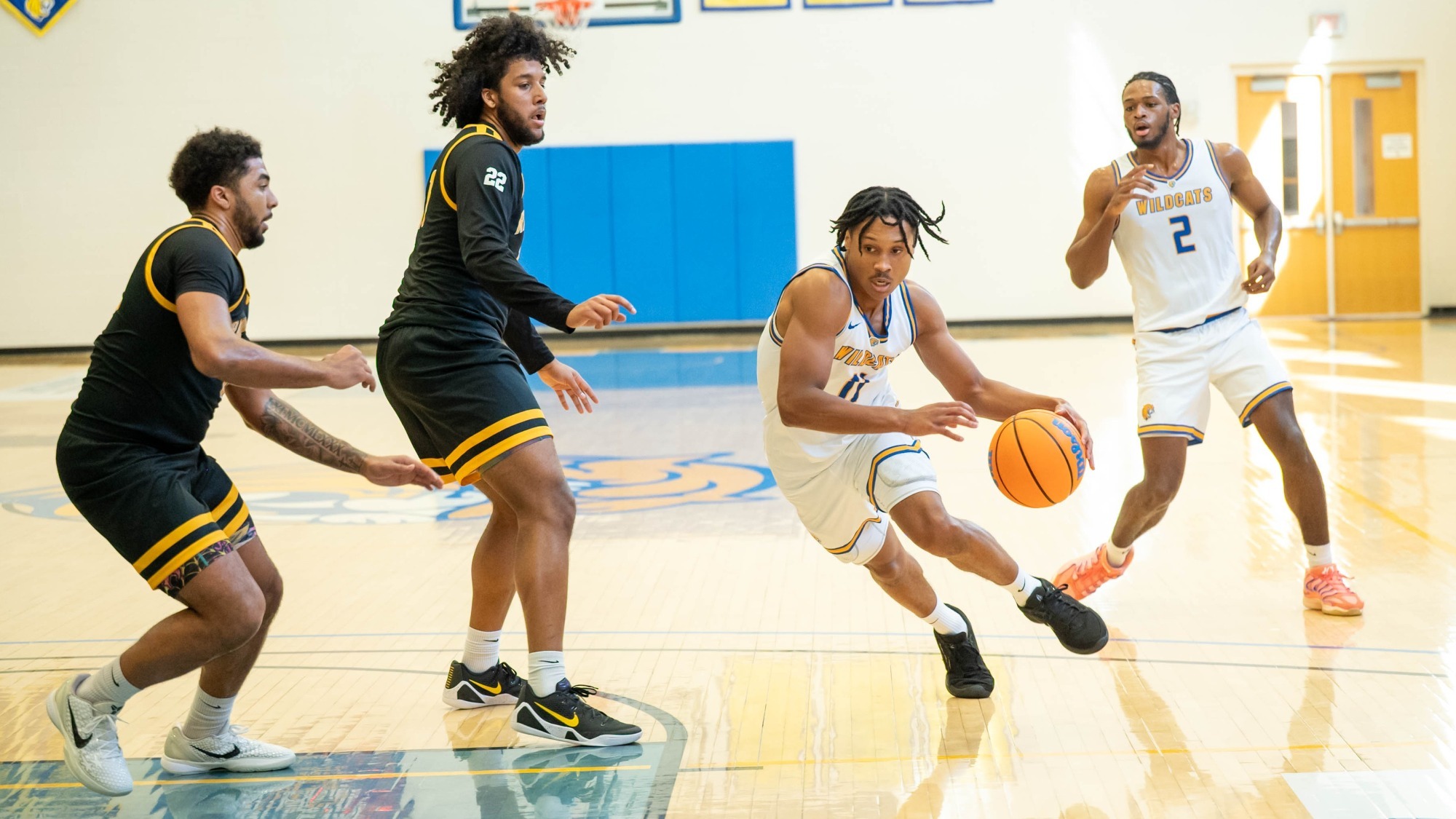 man dribbling a basketball