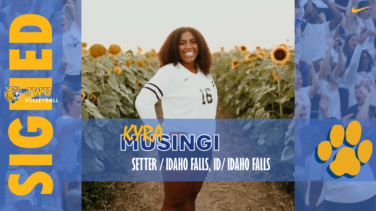 Woman standing in a field of sunflowers