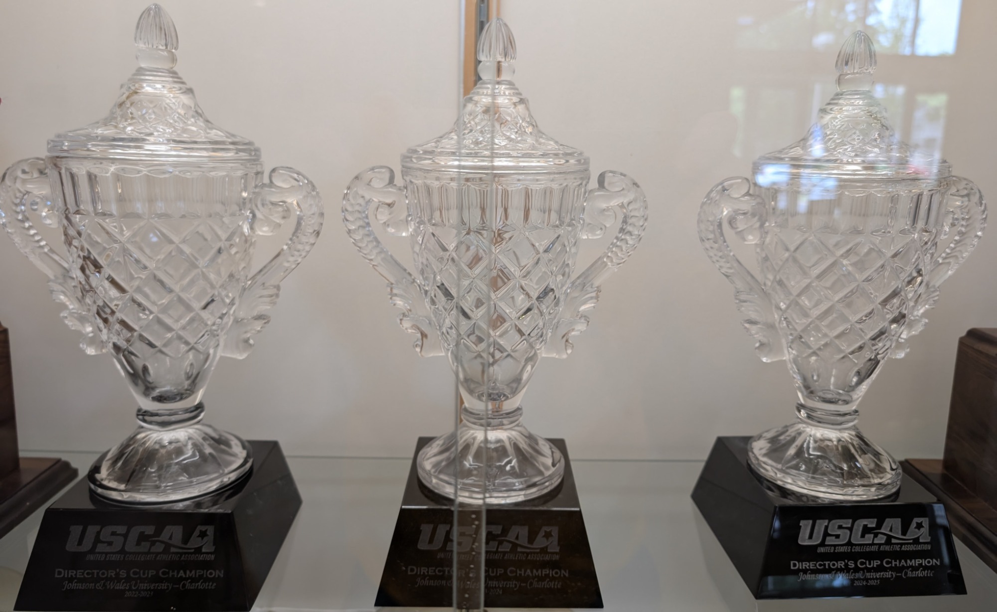 three crystal trophies