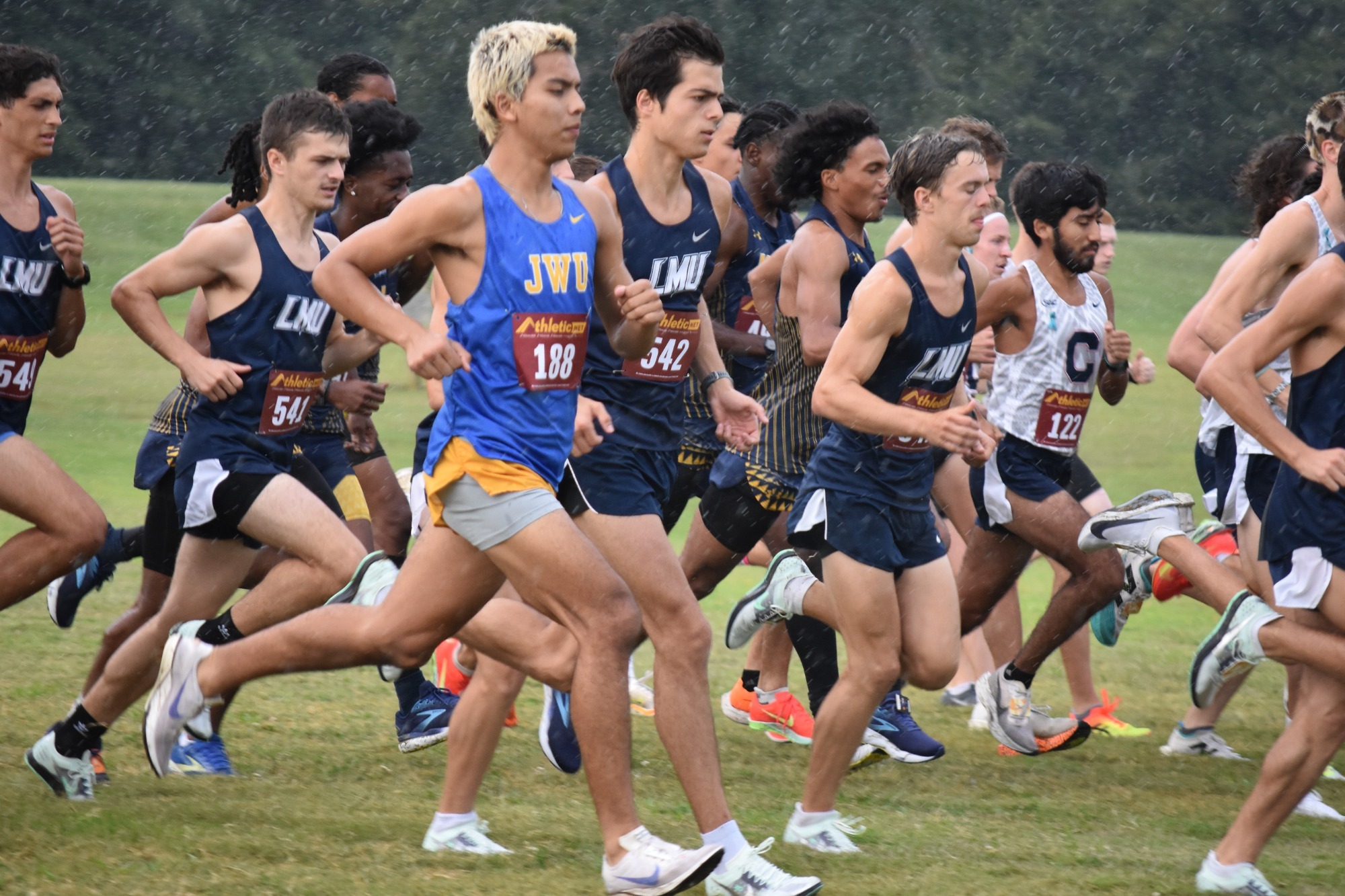 men running in a field