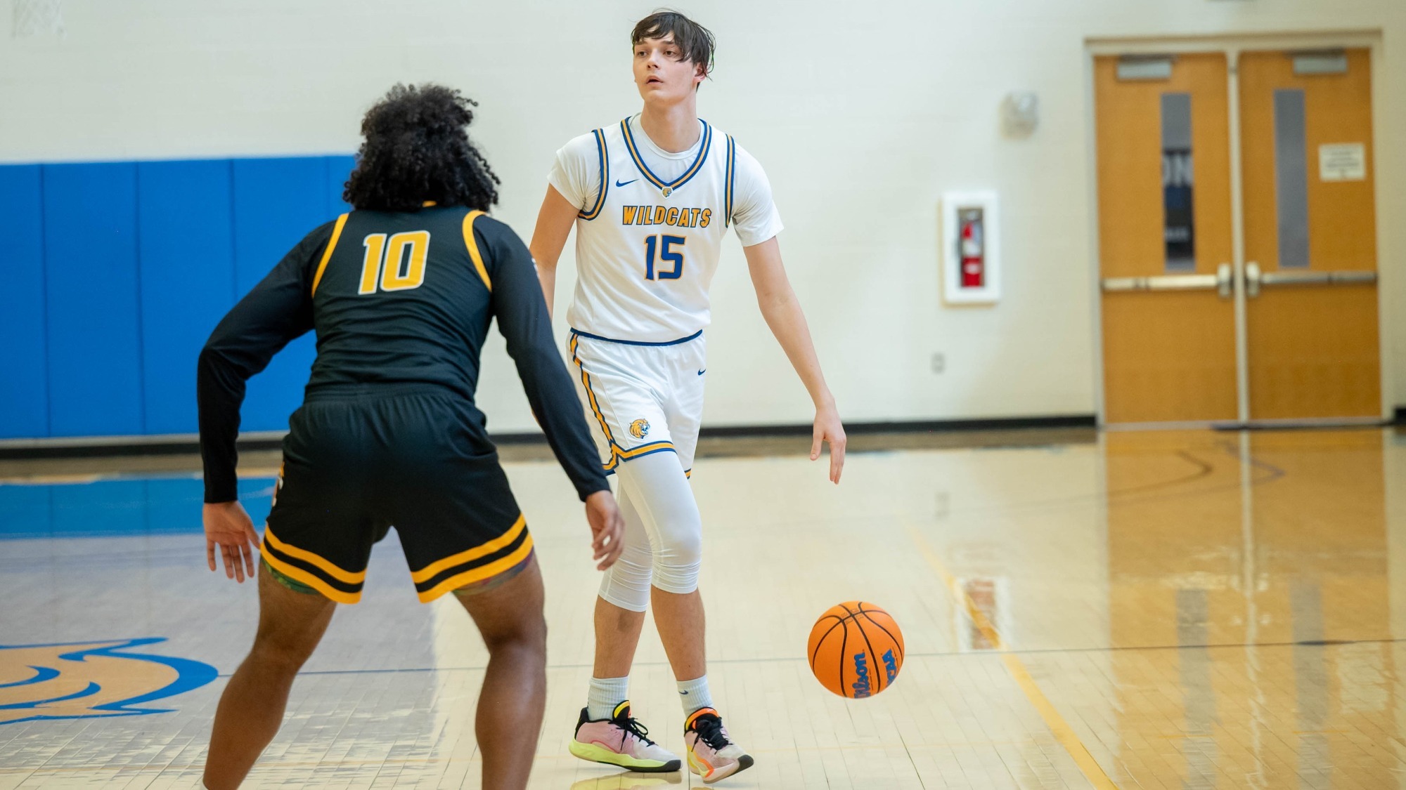 man dribbling a basketball