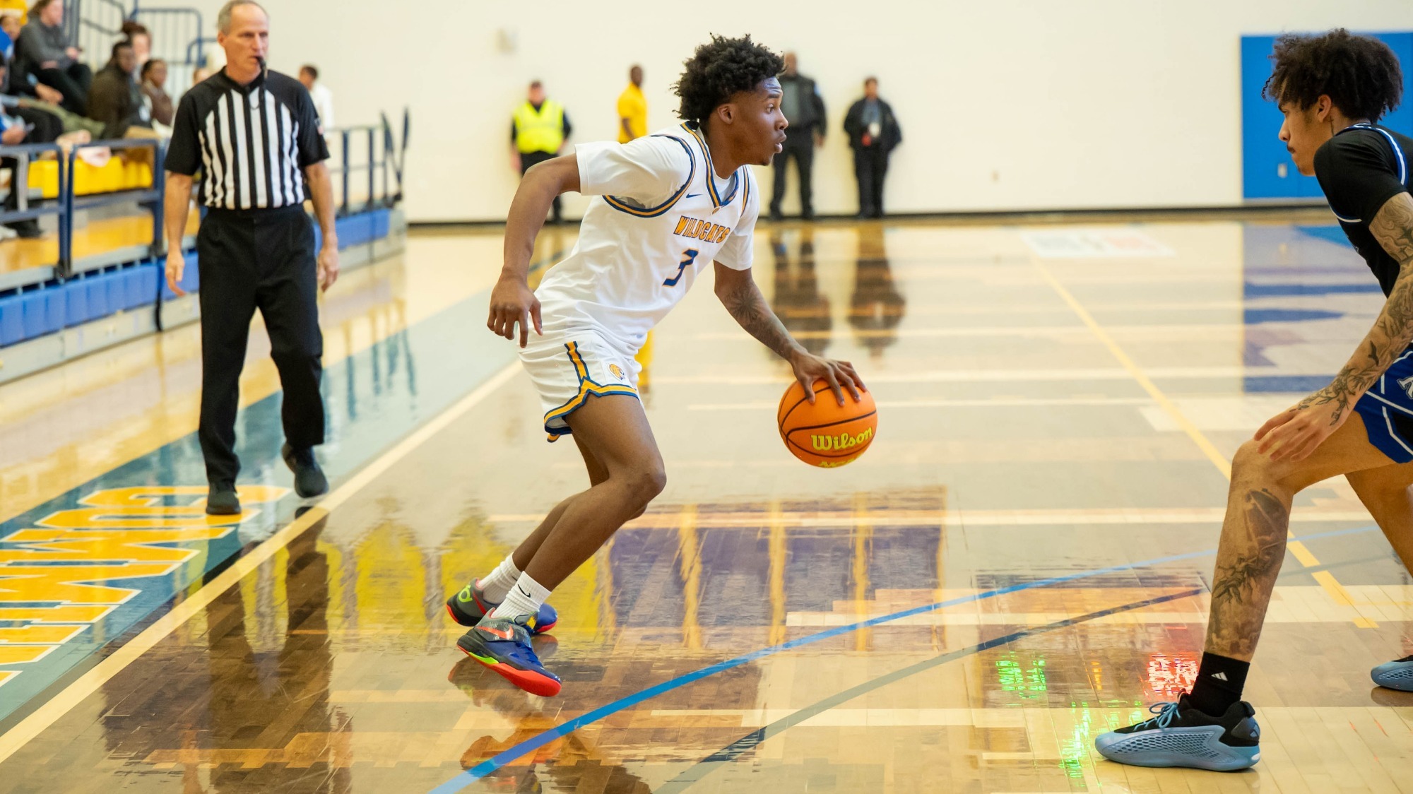 man dribbling a basketball