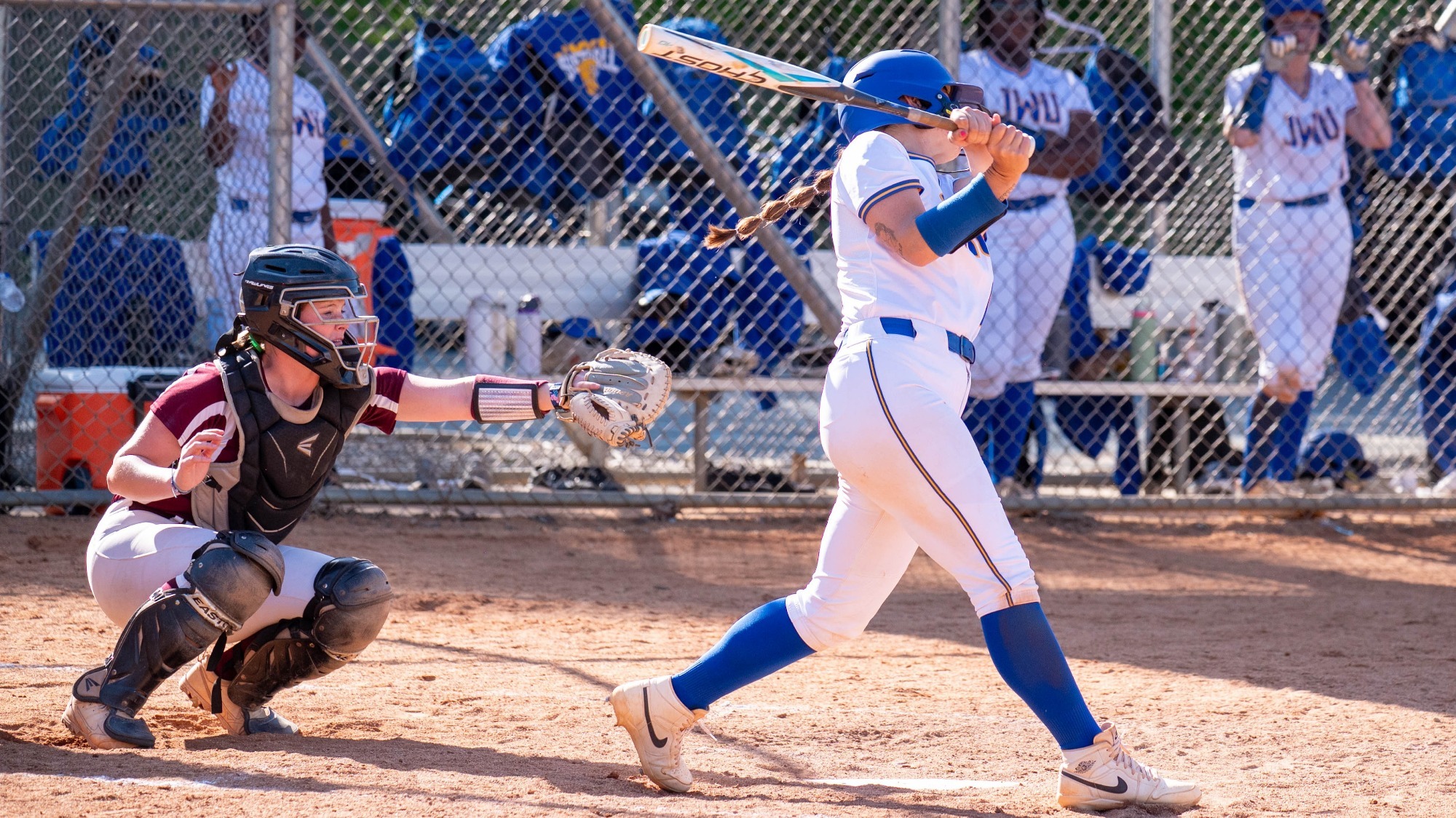 woman swinging a softball bat