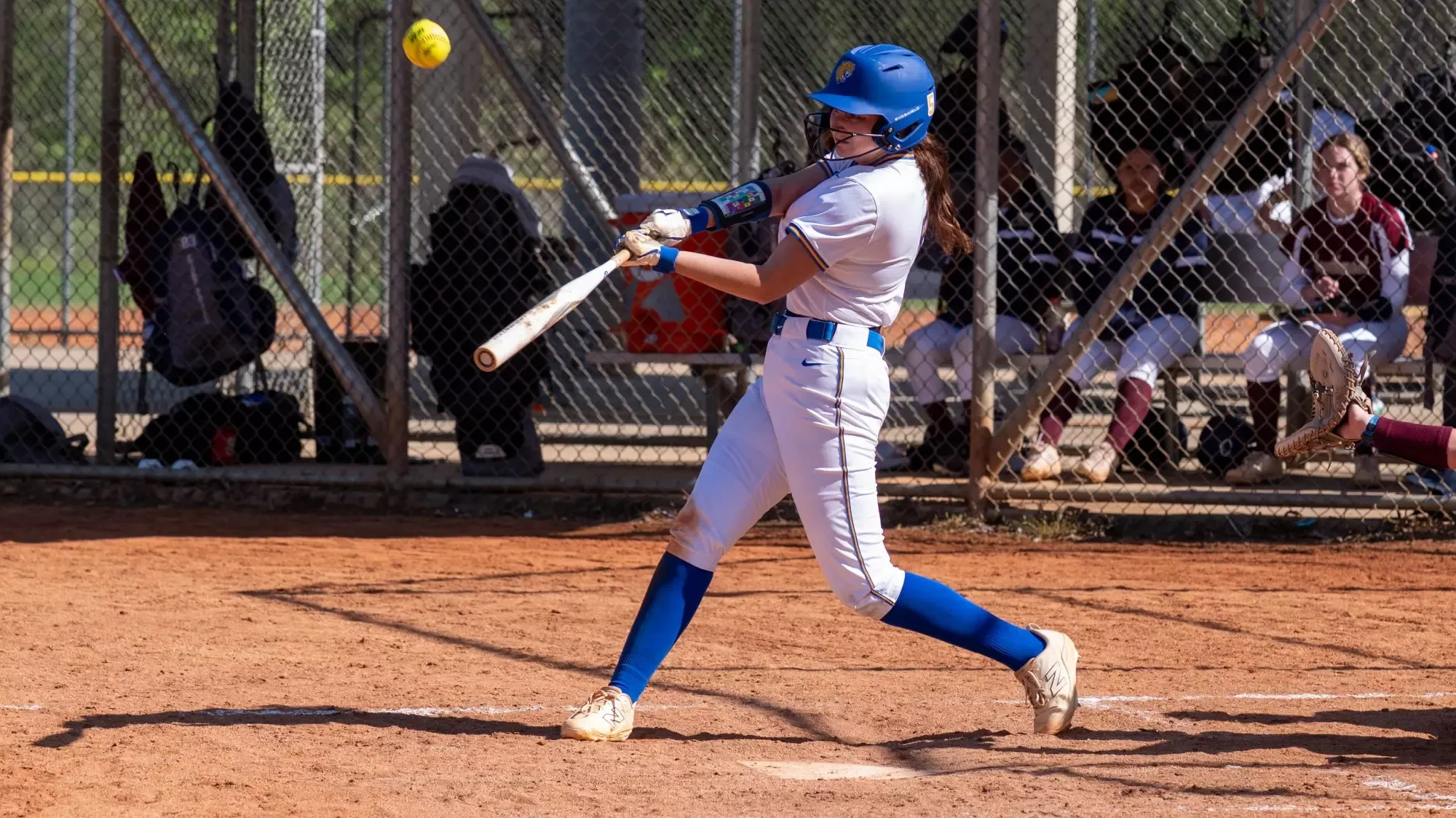 woman hitting a softball