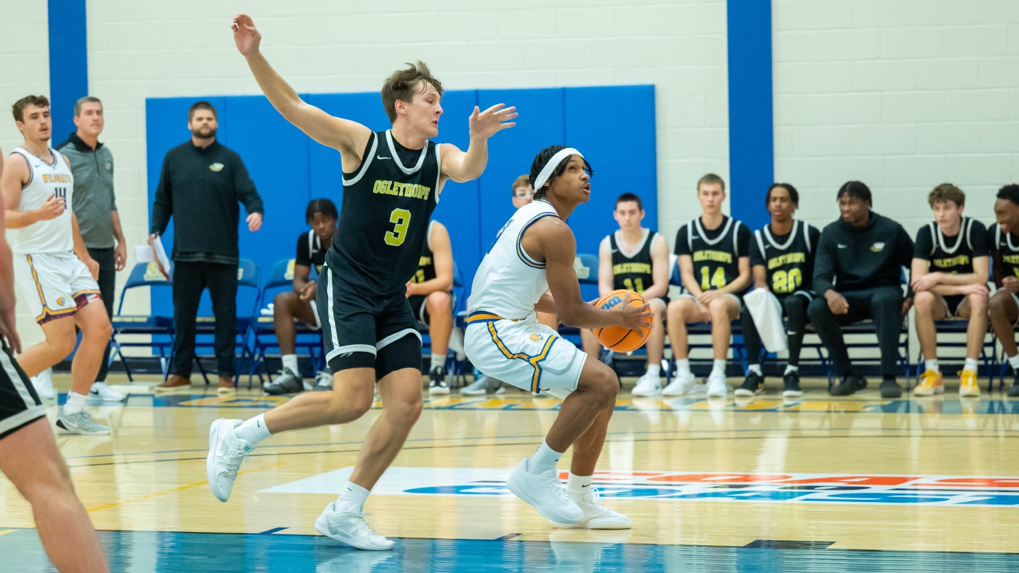 man shooting a basketball
