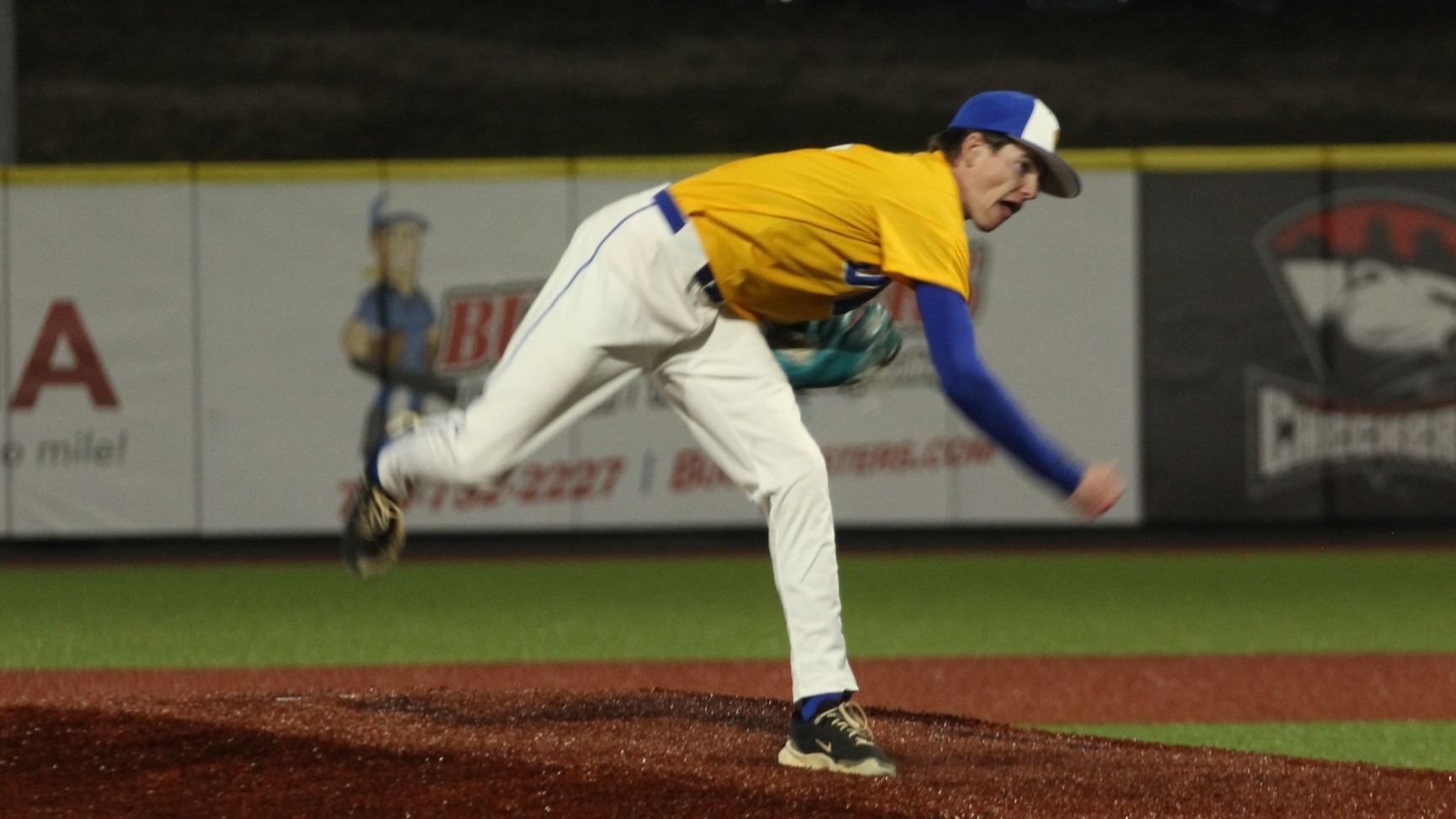 man pitching a baseball