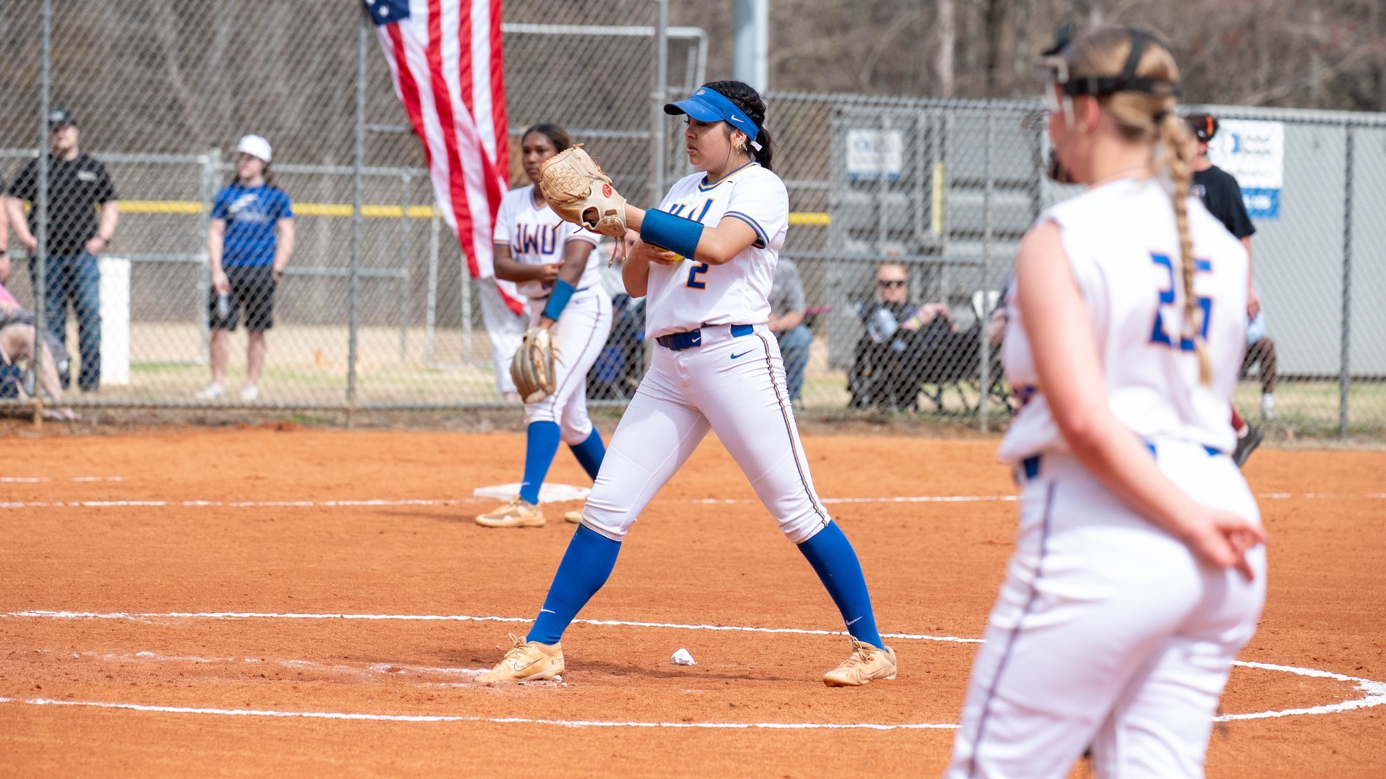 woman pitching a softball