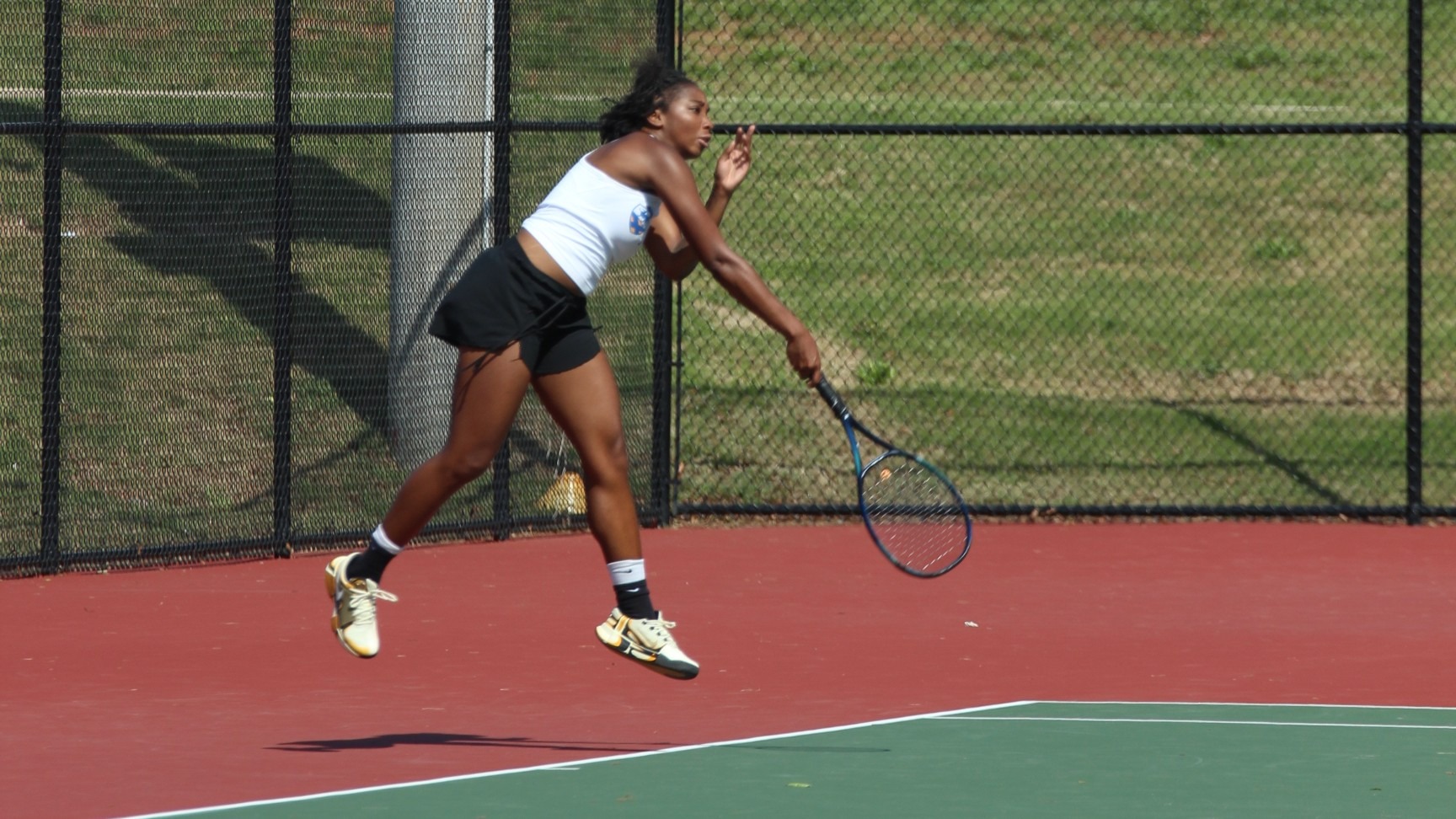 woman hitting a tennis ball