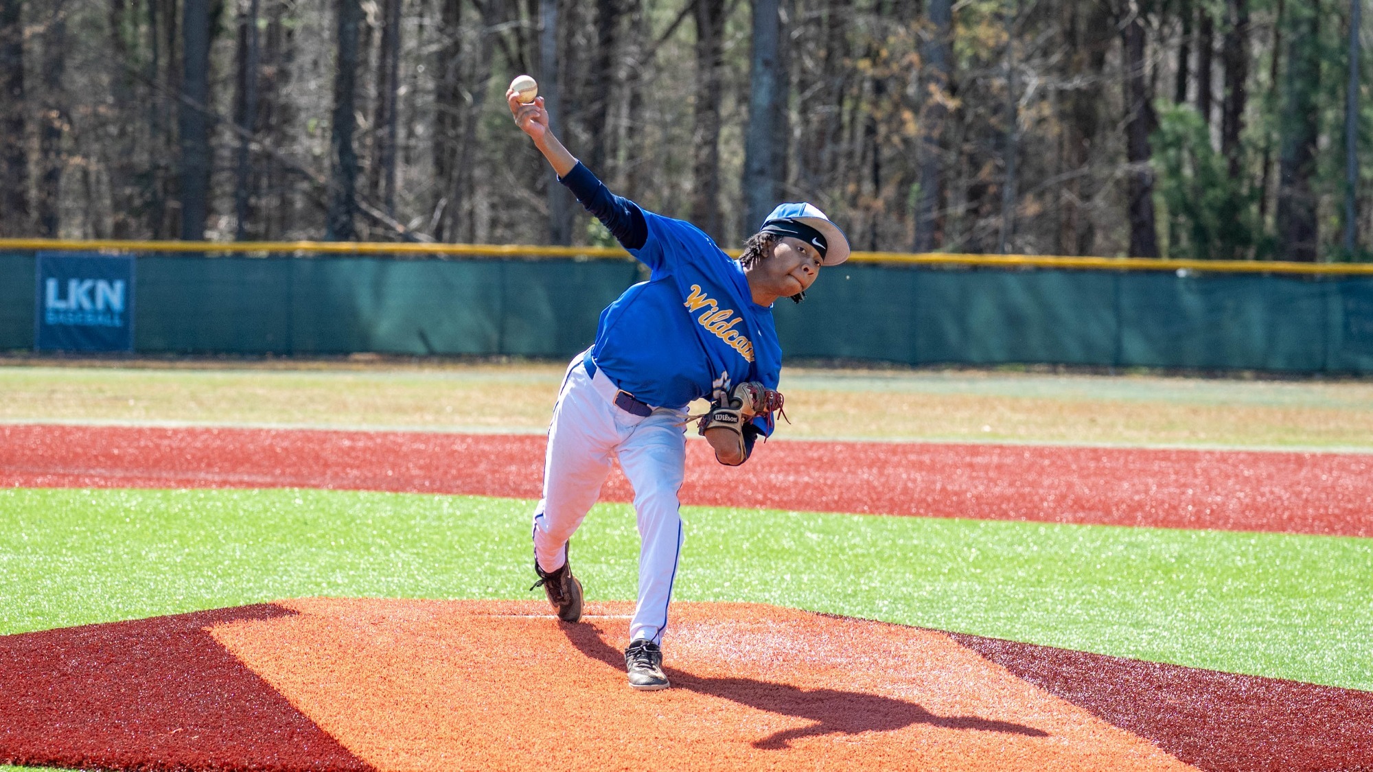 man pitching a baseball