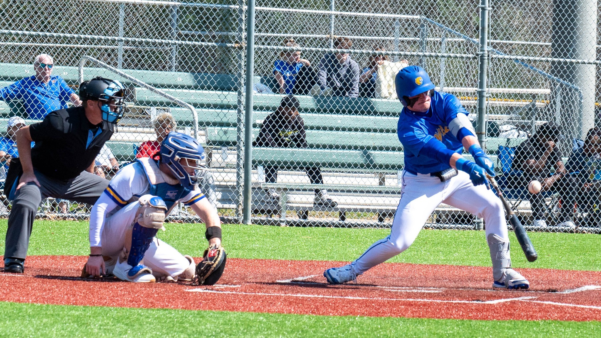 man swinging a baseball bat