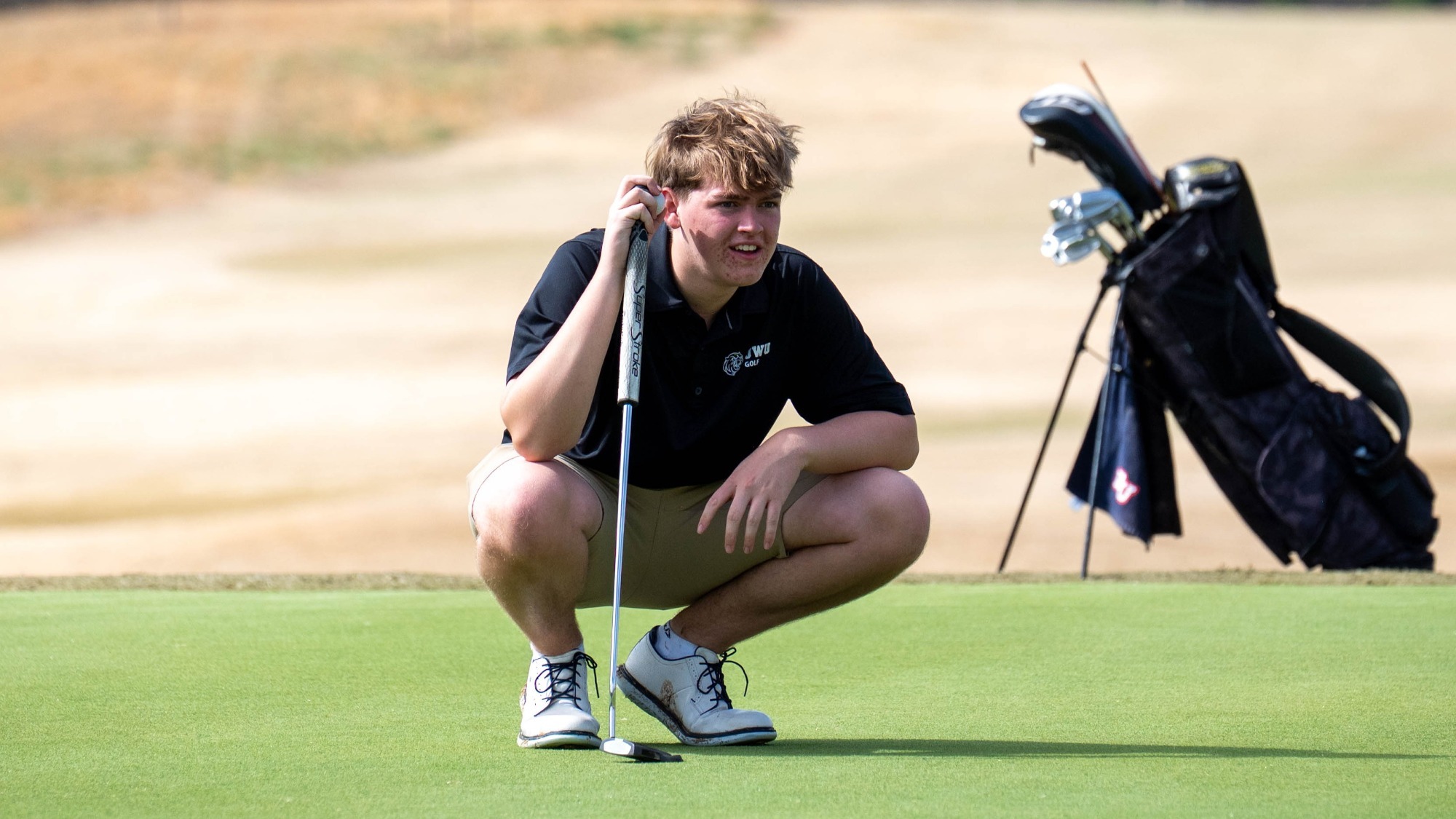 man lining up a putt