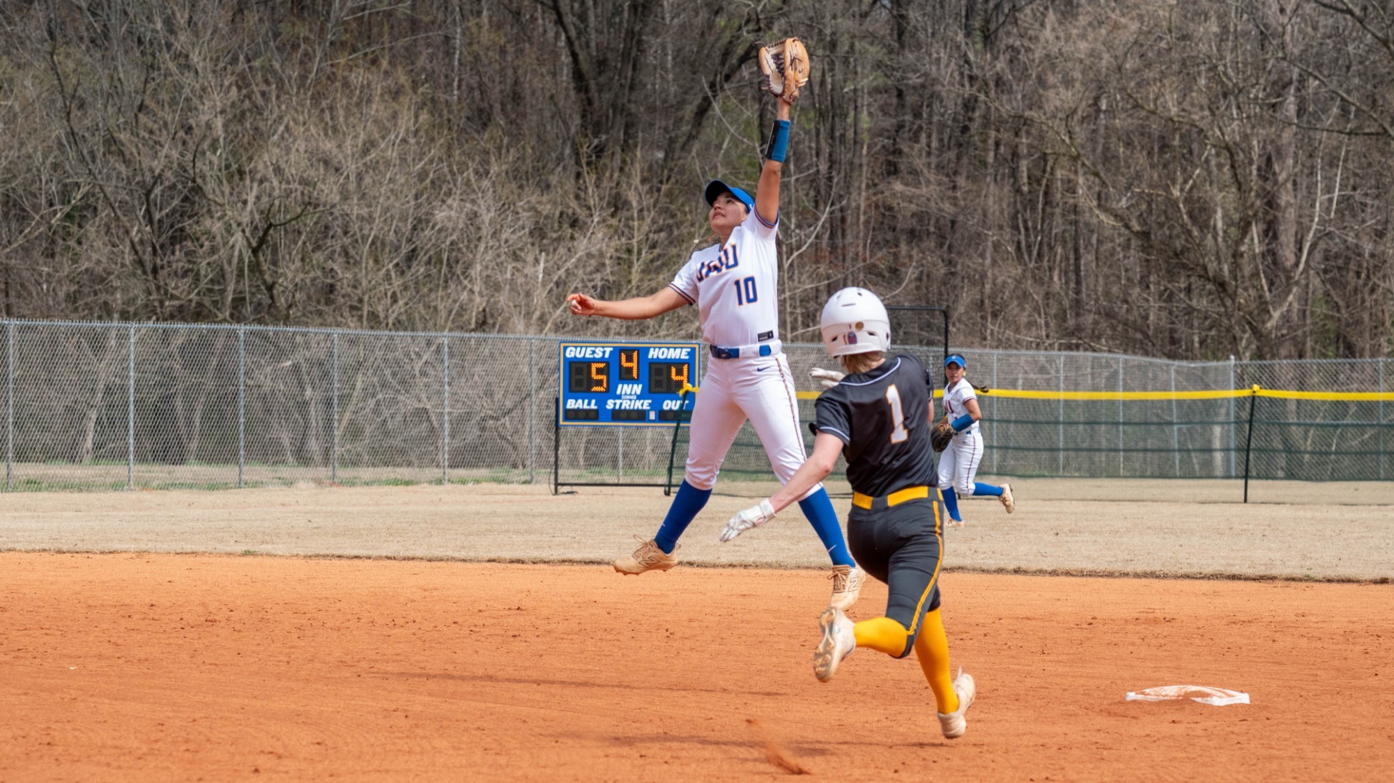 woman catching a softball
