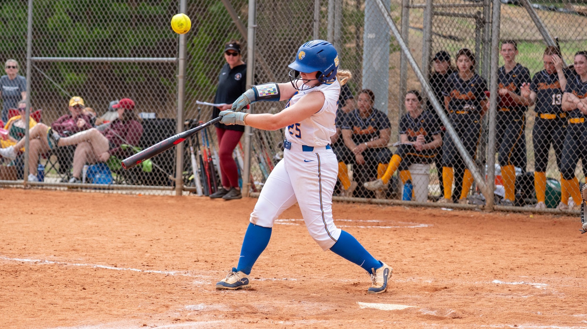 woman hitting a softball
