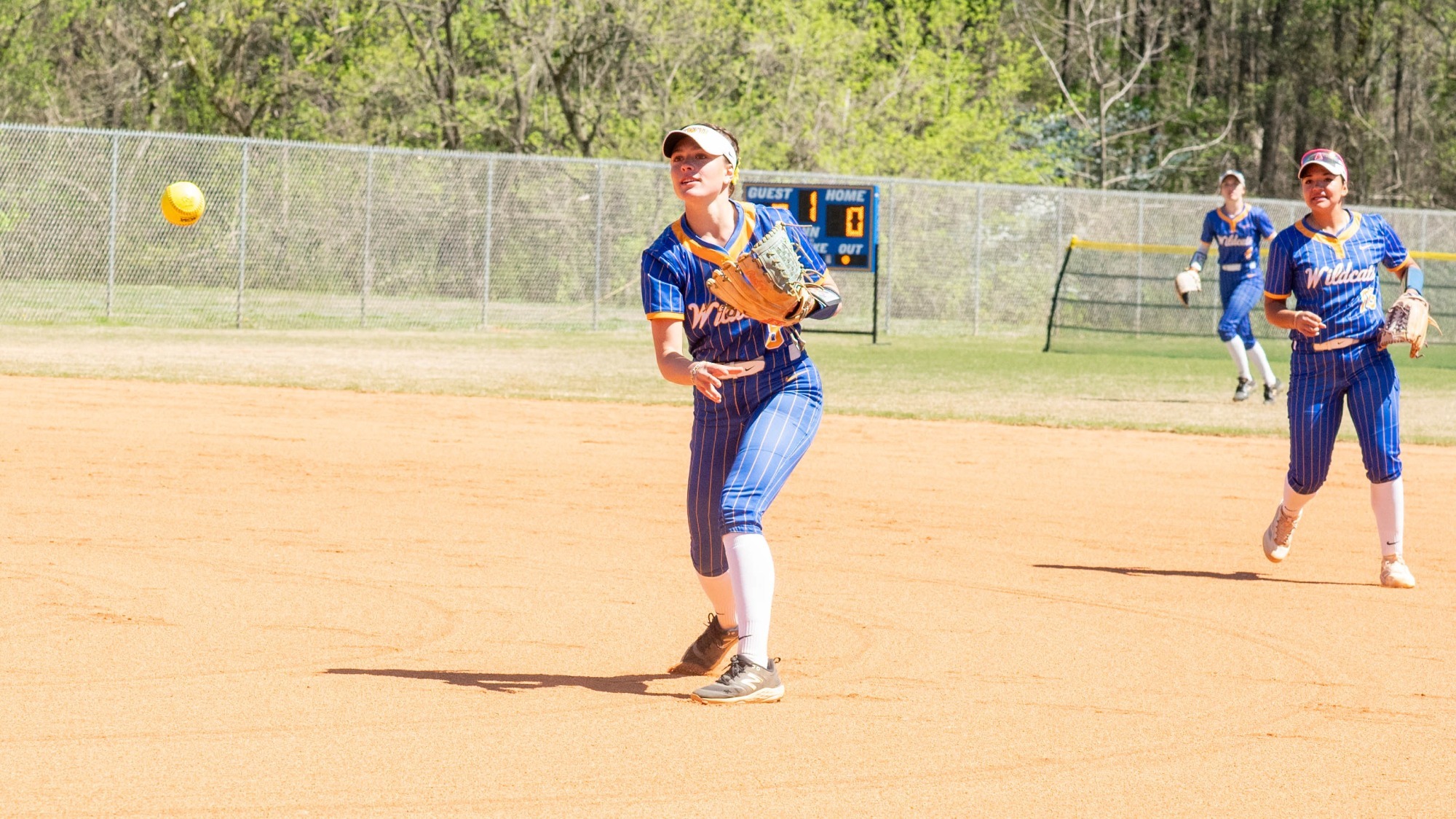 woman throwing a softball