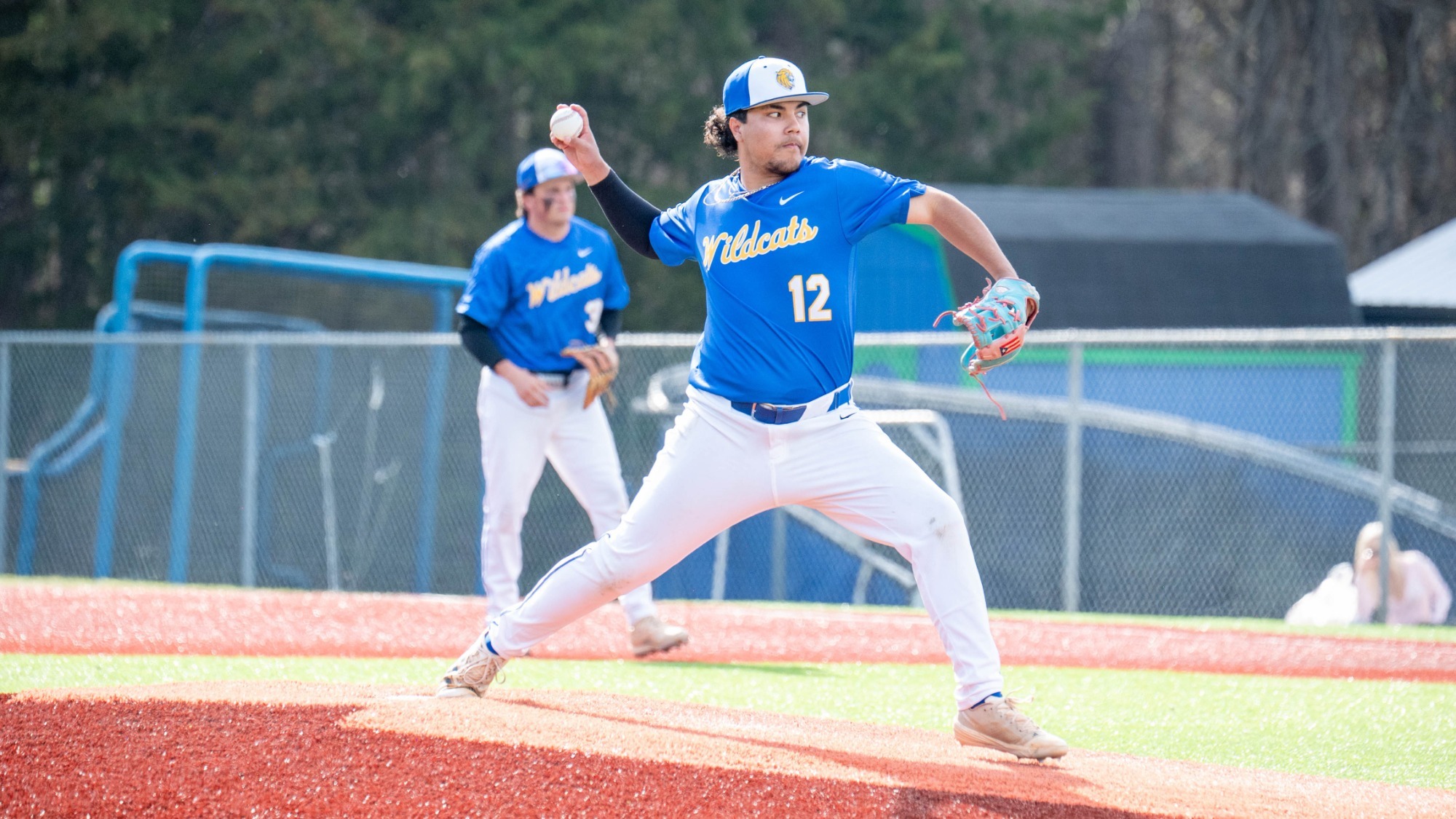 man pitching a baseball