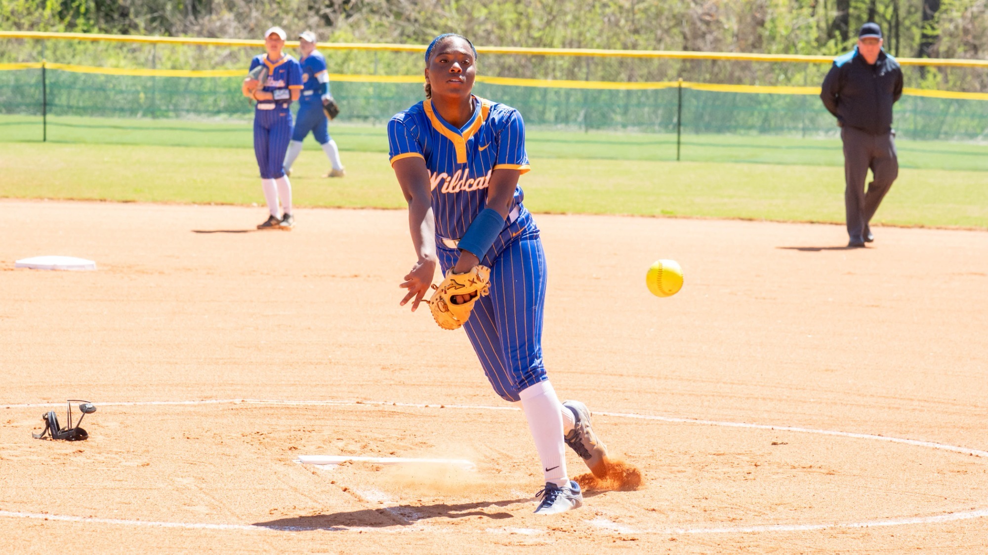 woman pitching a softball