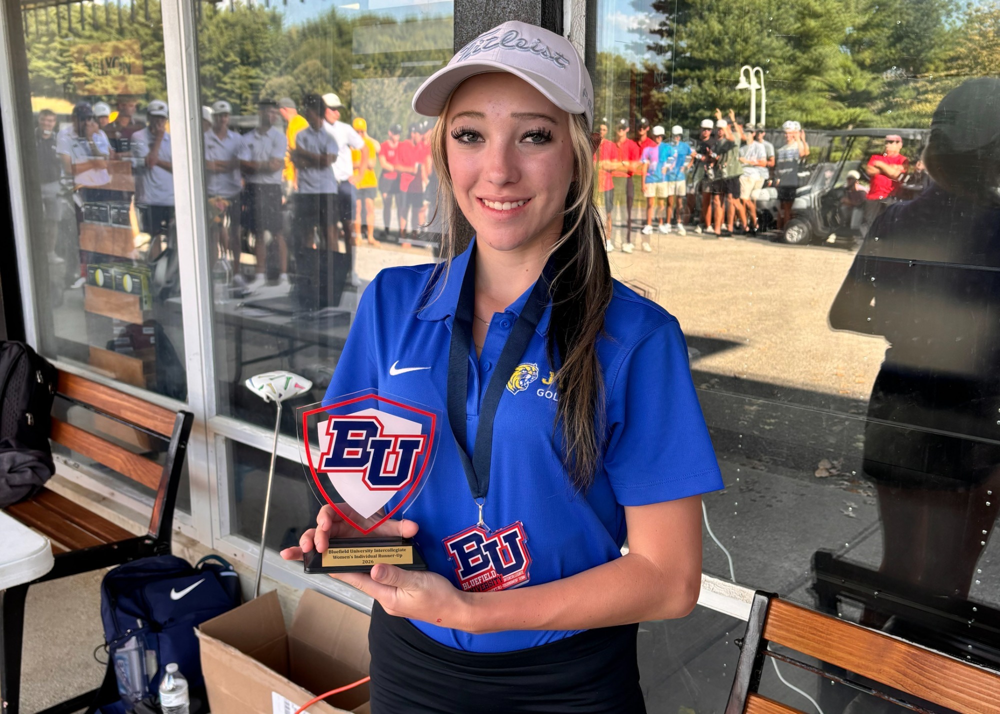 woman holding a trophy