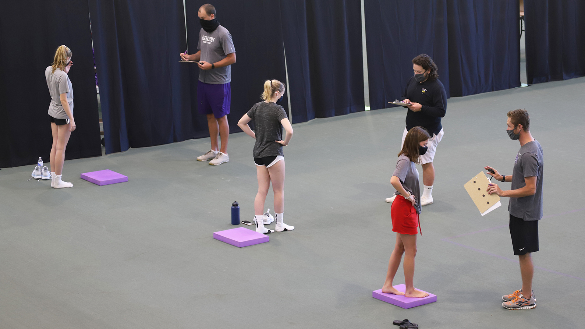 Kenyon staff helping administer testing tests at Toan Track