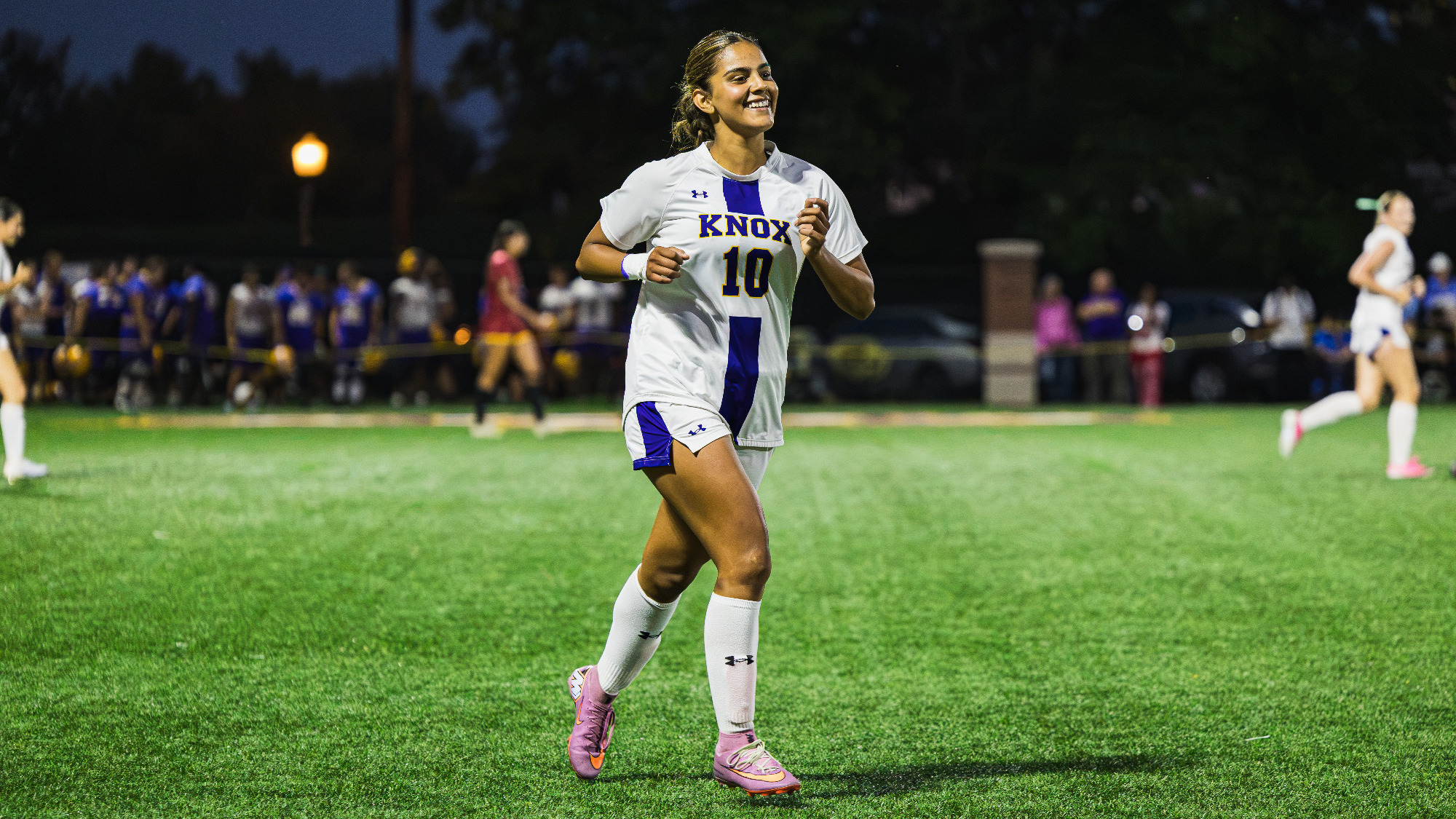 Eliana Juarez jogs to the sideline to celebrate with team.